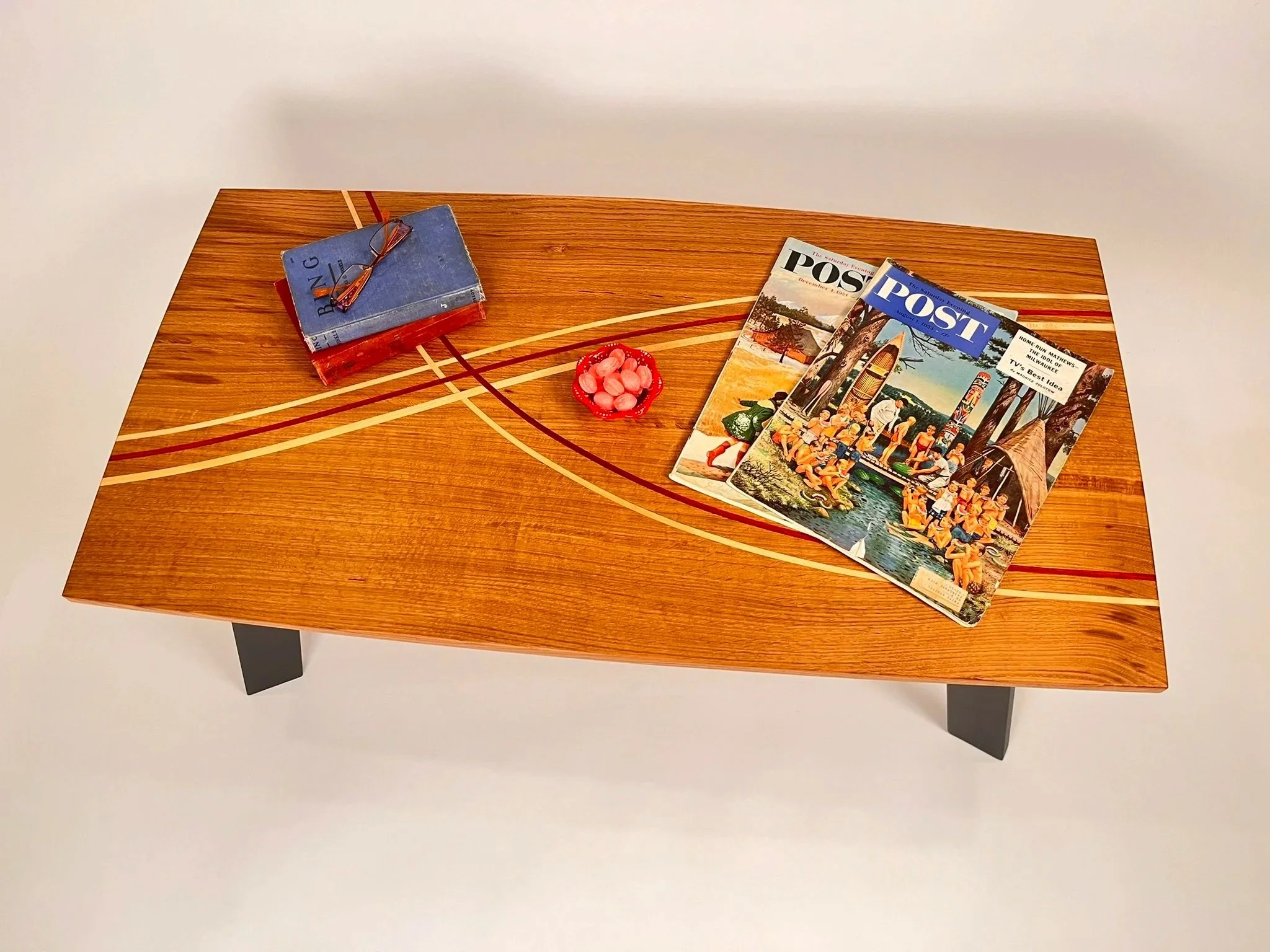 Another example of exotic wood inlays in beautiful, book matched white oak.
