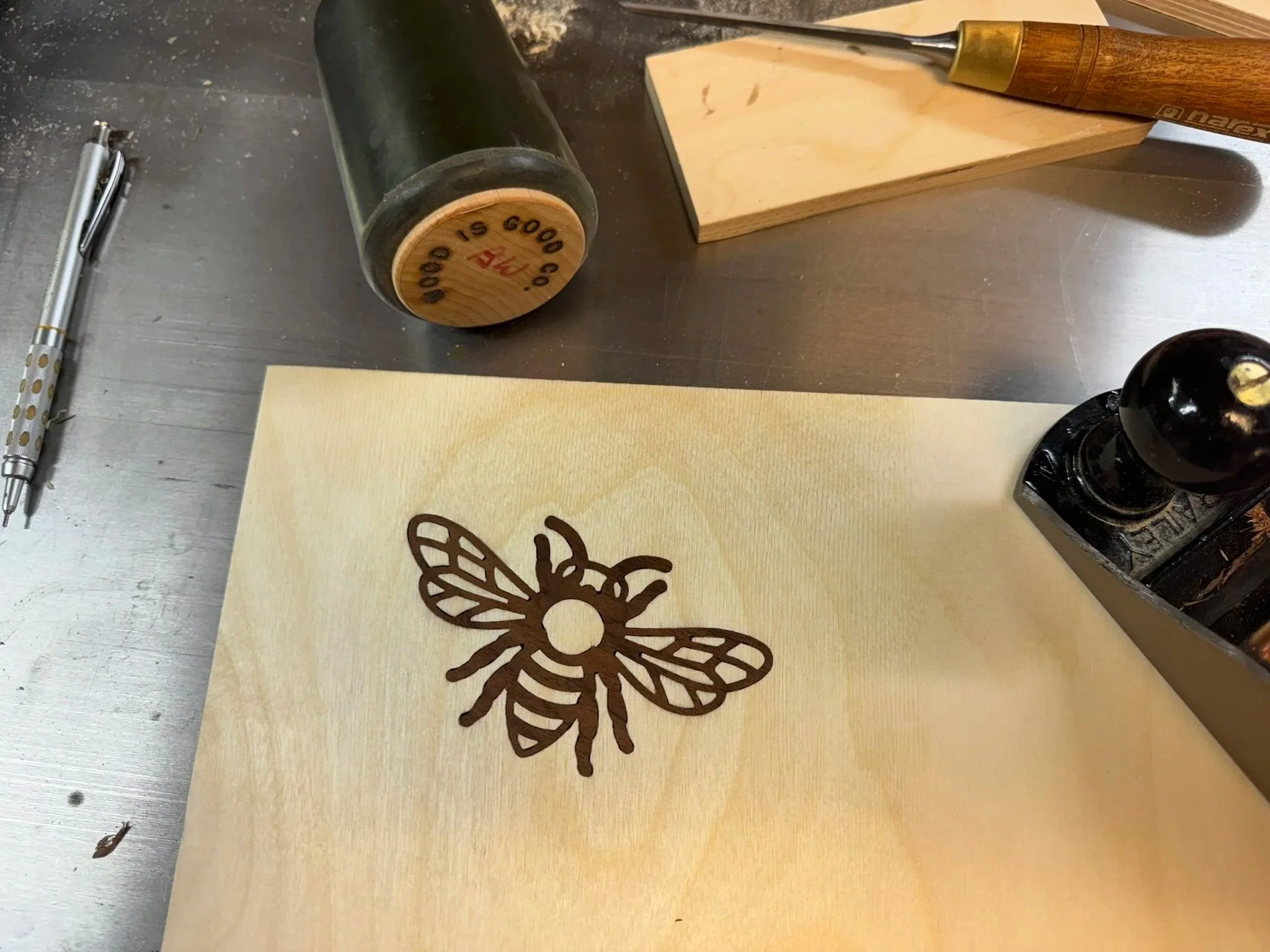 Finished honeybee solid walnut inlay in Baltic birch plywood prototype