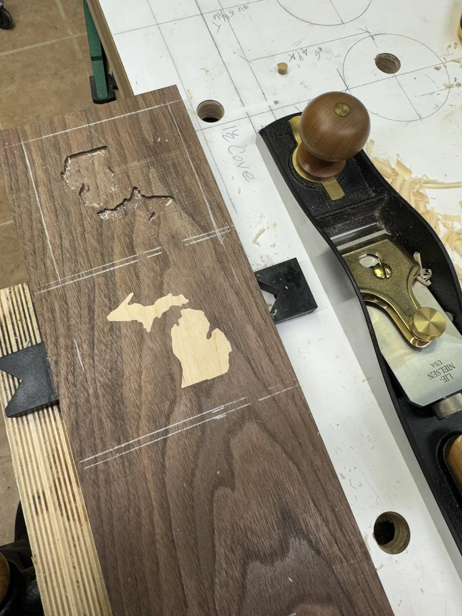 Here is a solid walnut with maple inlay.  