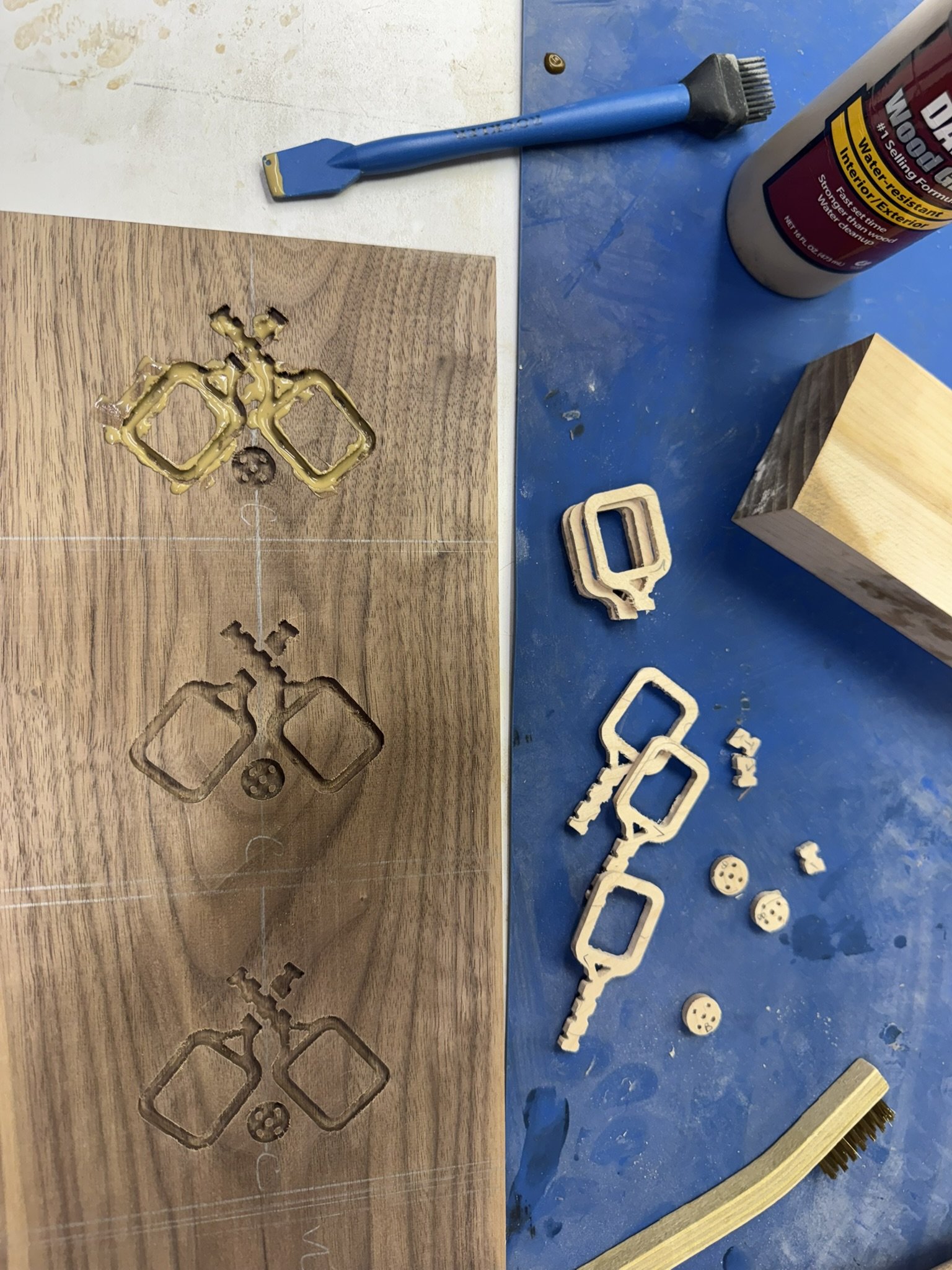 Installing the solid maple wood inlays into solid walnut.