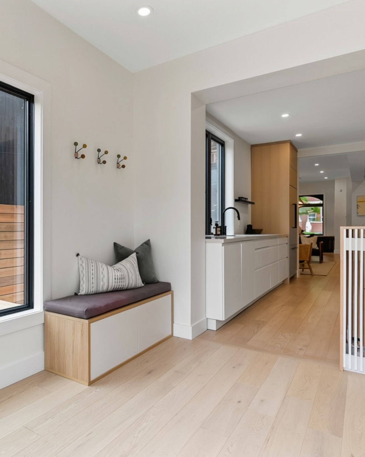 Finished mudroom bench and built-in hooks, Grace Street Victorian renovation Toronto