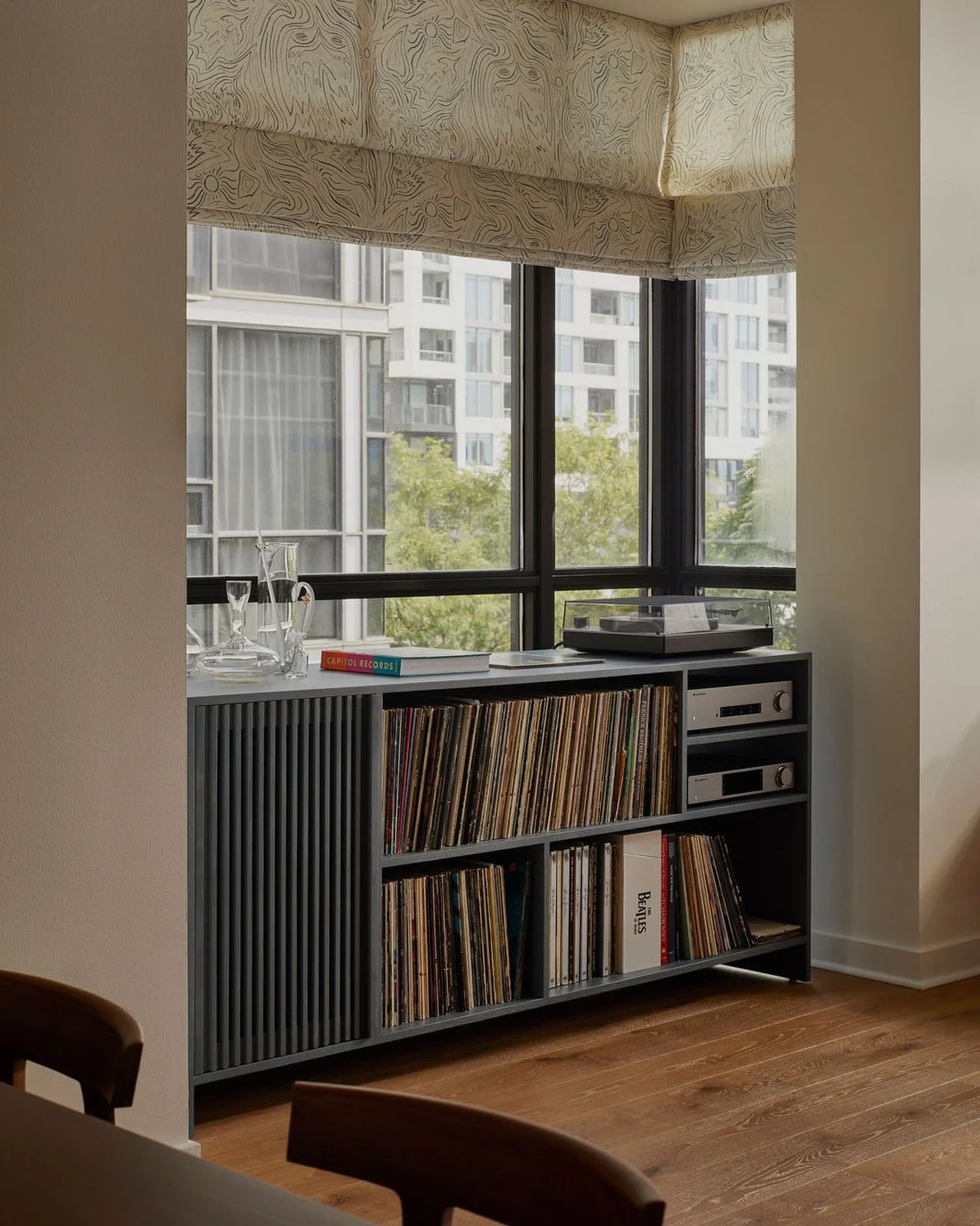 Making sure our clients feel heard is the foundation of our work. For this home, we designed a custom record cabinet and bar cabinet that brings together storage, function, and personality &ndash; a true multipurpose piece tailored to the way they li