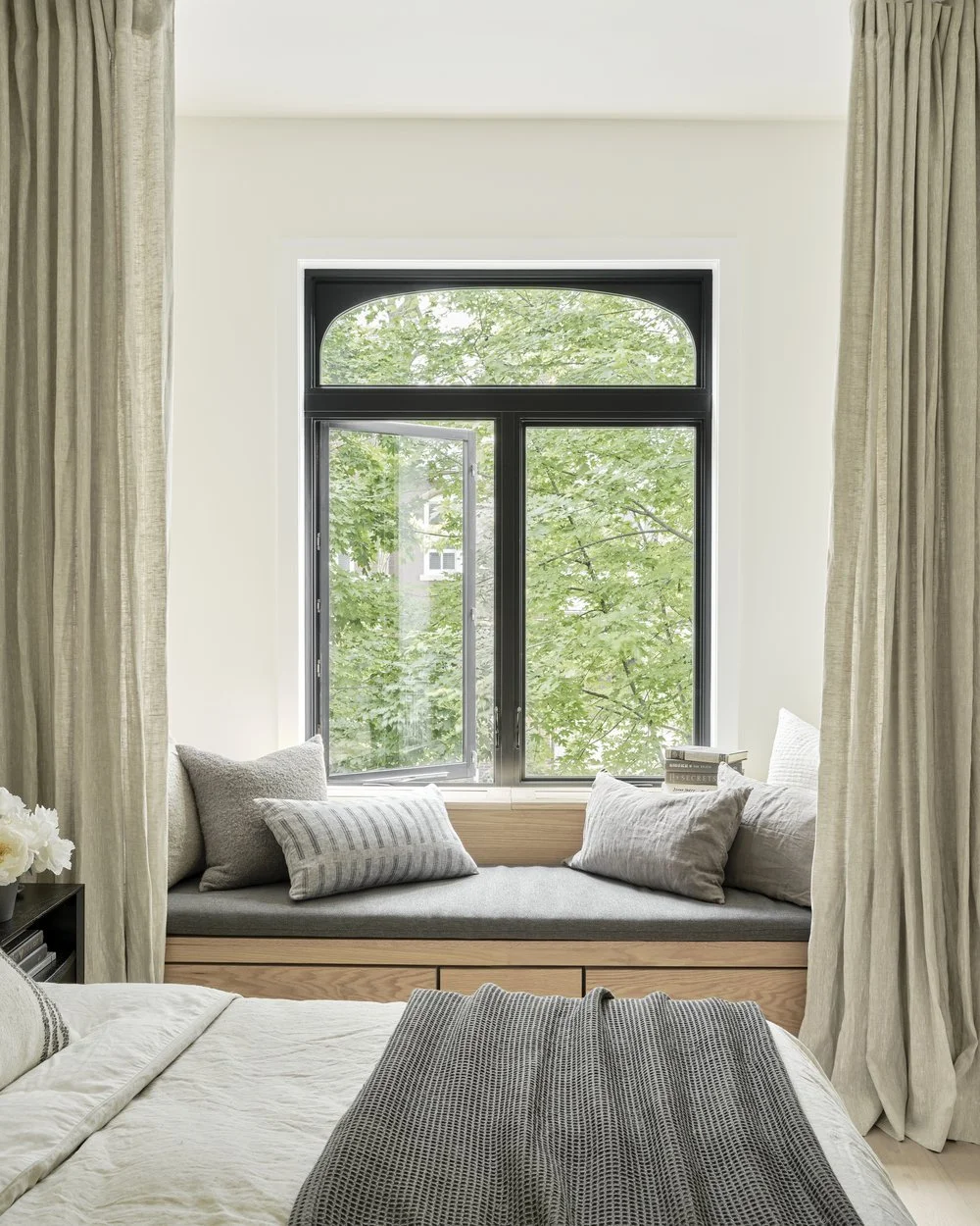 Finished built-in window seat over the radiator in the primary bedroom, Grace Street Victorian renovation Toronto