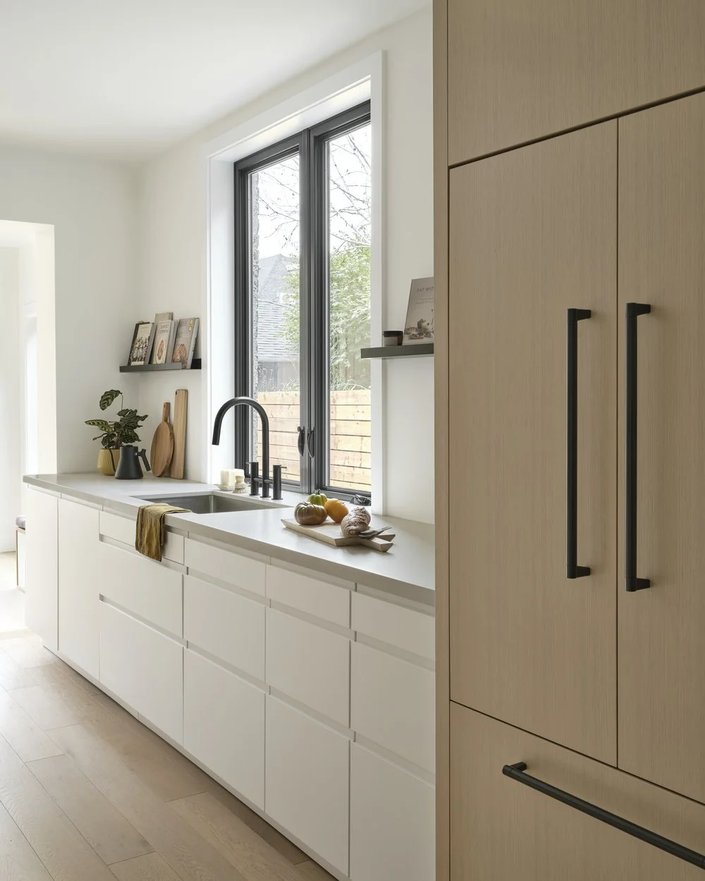 Finished kitchen sink and panel-ready fridge, Grace Street Victorian renovation Toronto
