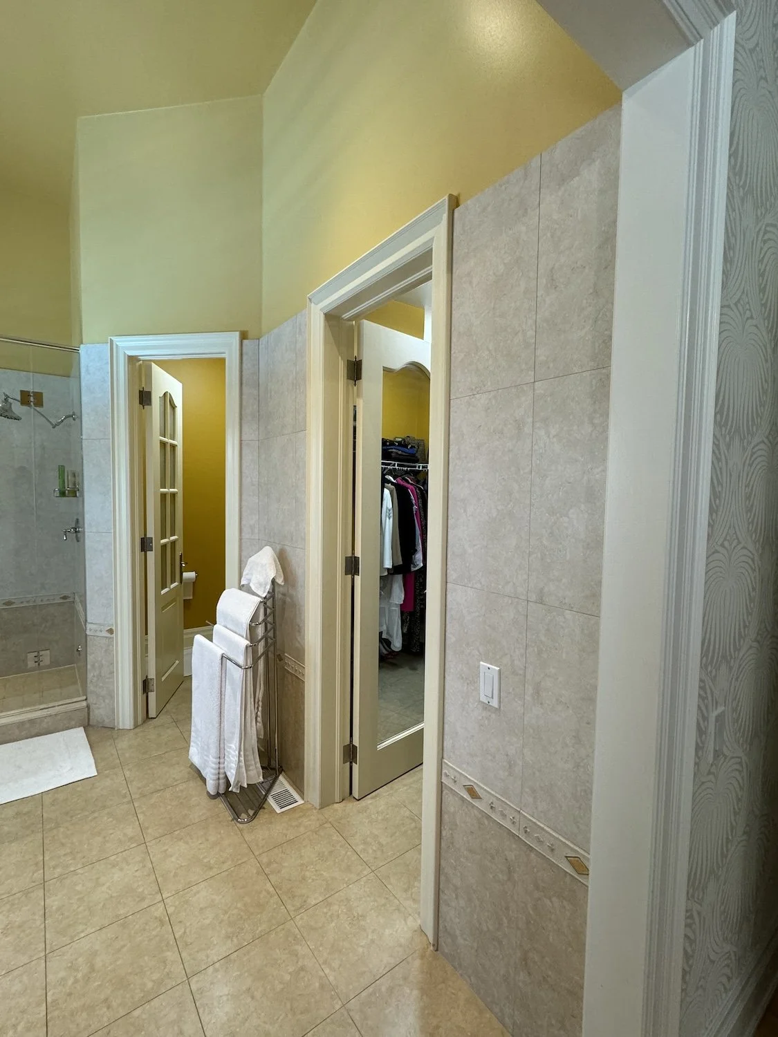 Primary ensuite before renovation, Unionville: water closet door, closet entrance, and shower stall