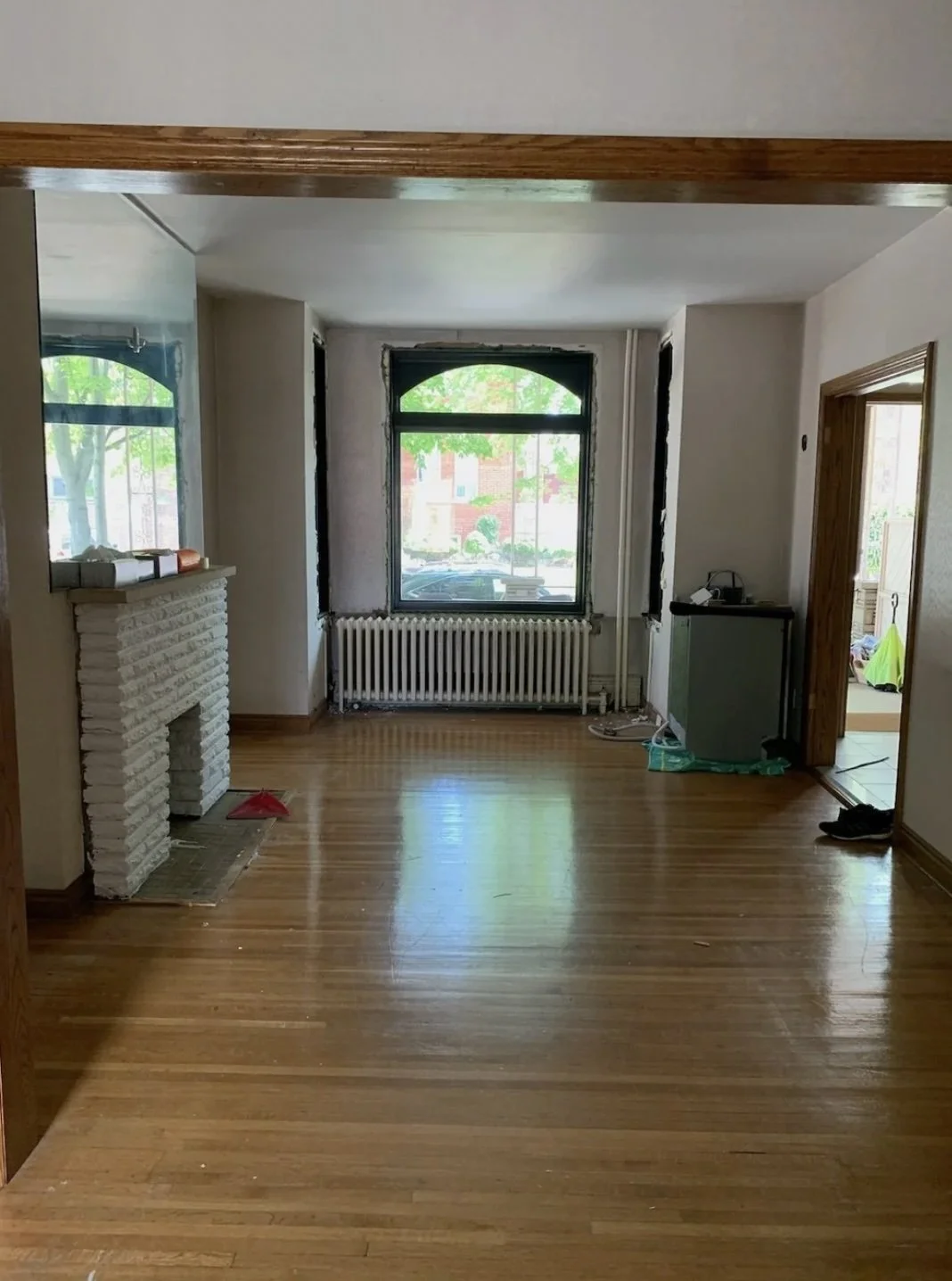 Original decommissioned fireplace before renovation, Grace Street Victorian home Toronto
