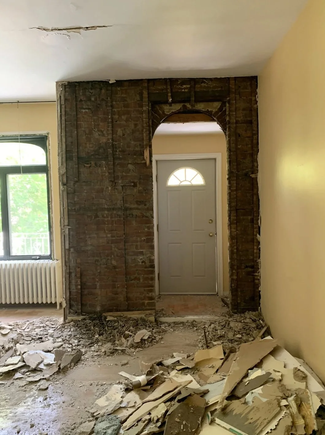 Original brick archway exposed during demo, Grace Street Victorian renovation Toronto