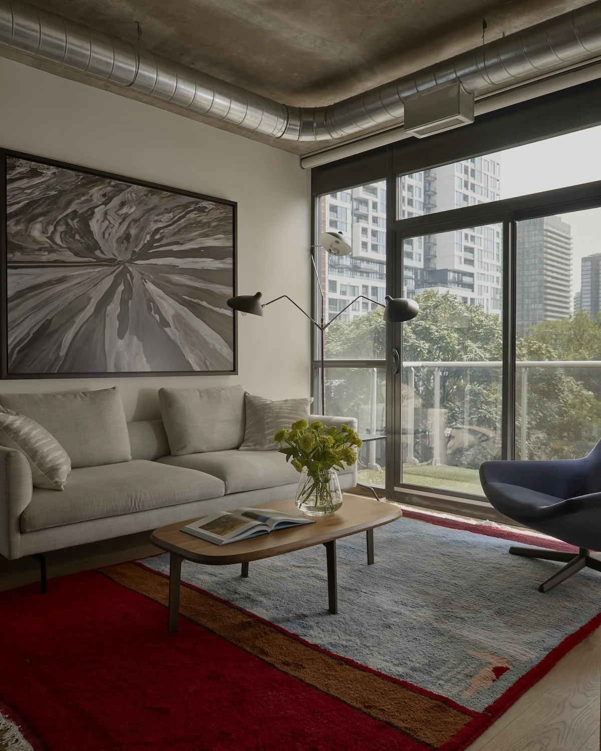 niagara-condo-living-room-modern-sofa-area-rug-megan-crosbie-design.jpg