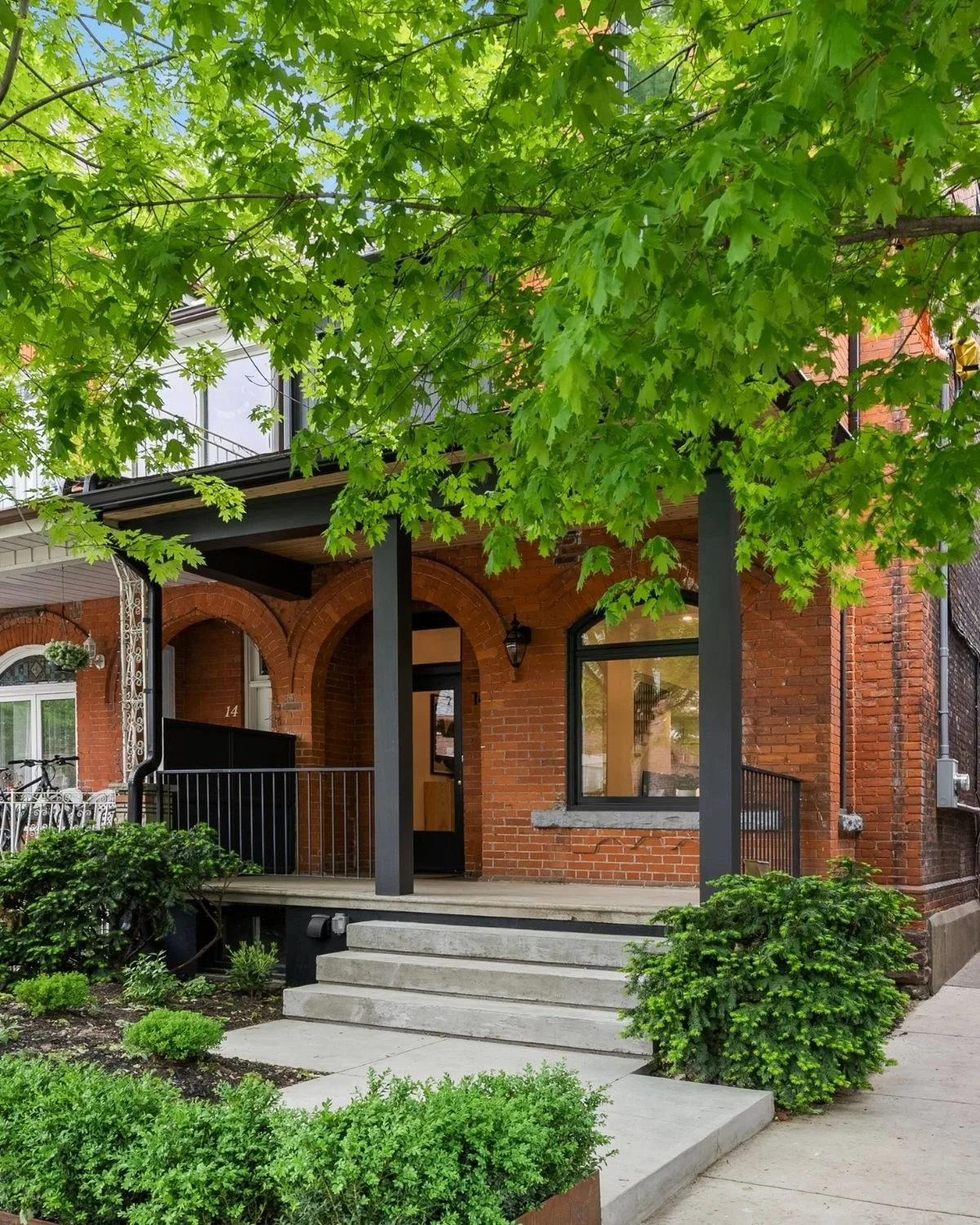 Red brick Victorian home exterior after renovation, Grace Street, Toronto