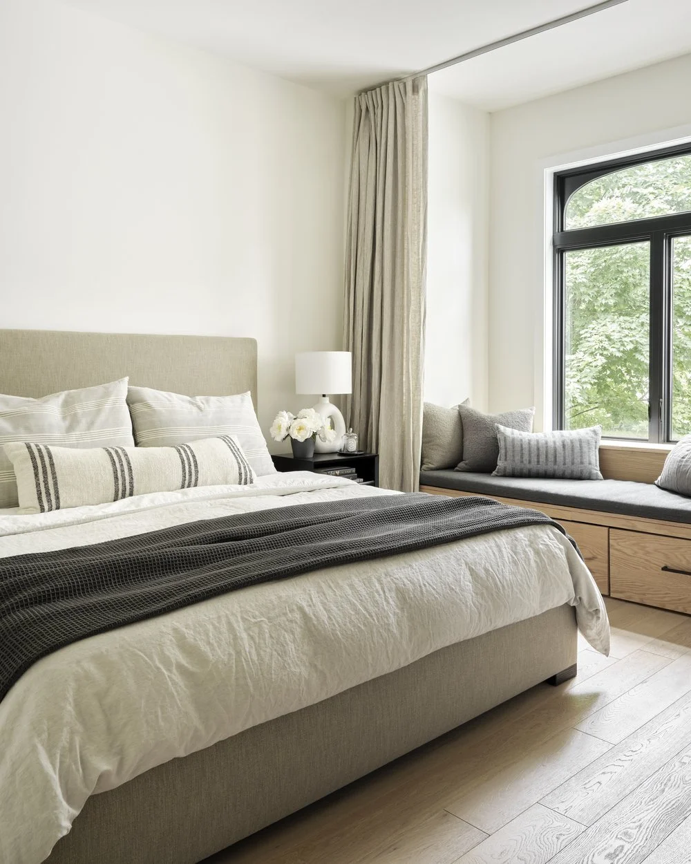 Finished primary bedroom with built-in window seat, Grace Street Victorian renovation Toronto