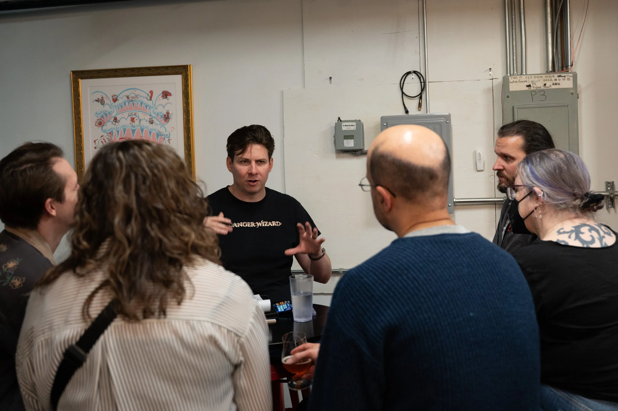 In the back corner of the barrel room is a circle of stools set up to provide a forum for attendees. As a free add-on to their ticket, gamers can opt-in to one of four scheduled discussions. Topics to choose from are "RPG Design", "DMing for kids", "