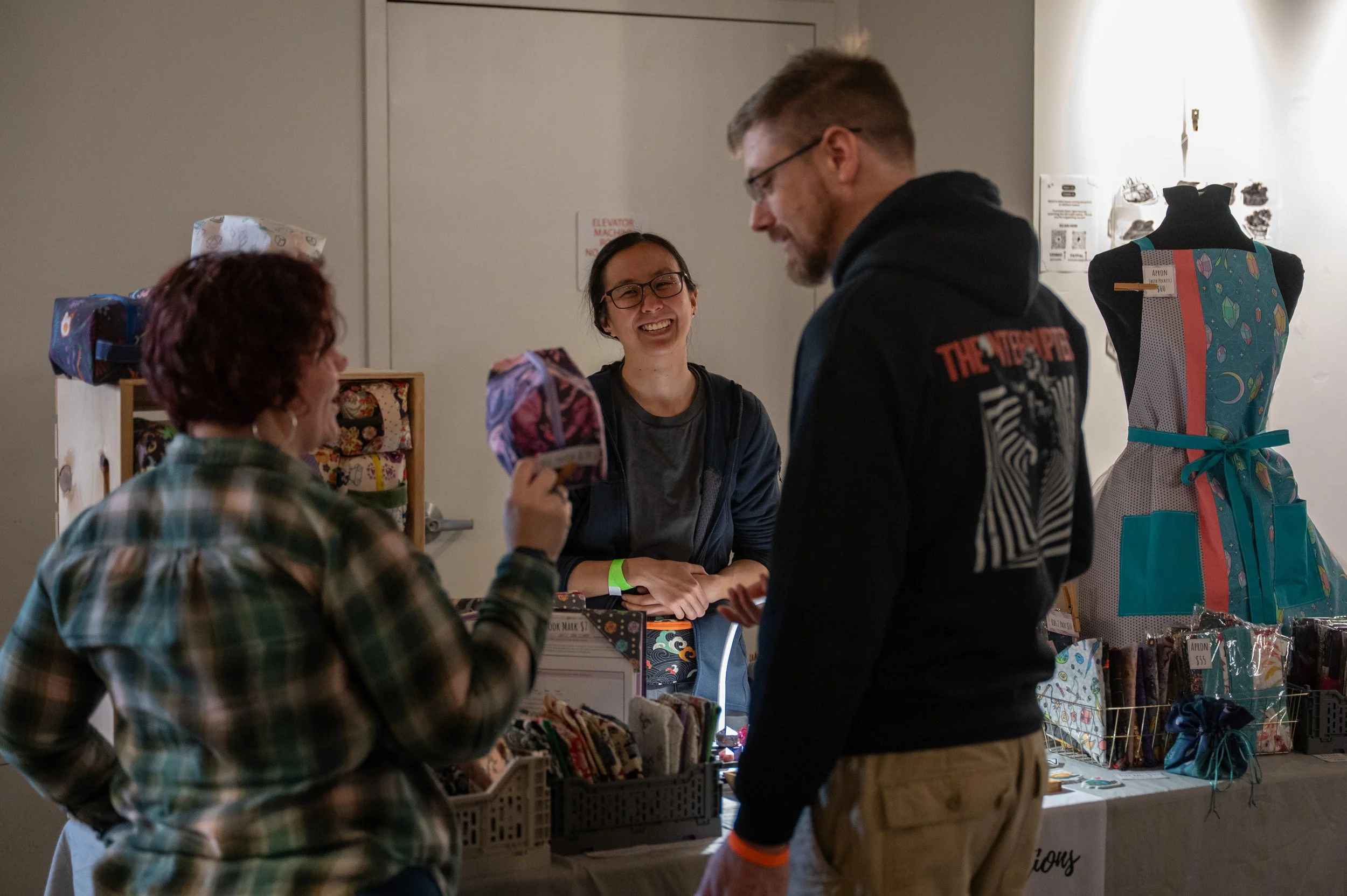 Danica Kawn tables for her two sister businesses, Little Wolf Dice and Little Wolf Sewing. She said this event is a bit different from previous ones she's brought the shop to. Outside of the Camberville area, "It's all people who say 'My kids play D&