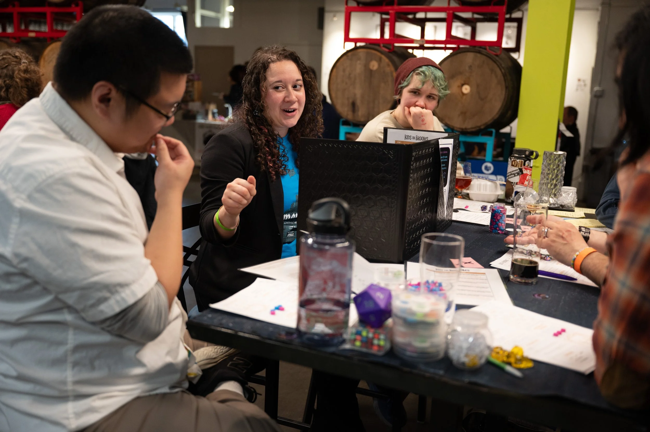 Heather Silva (Center) is the founder of Worlds 4 All, an RPG service company, and lead one of the convention's many  games.