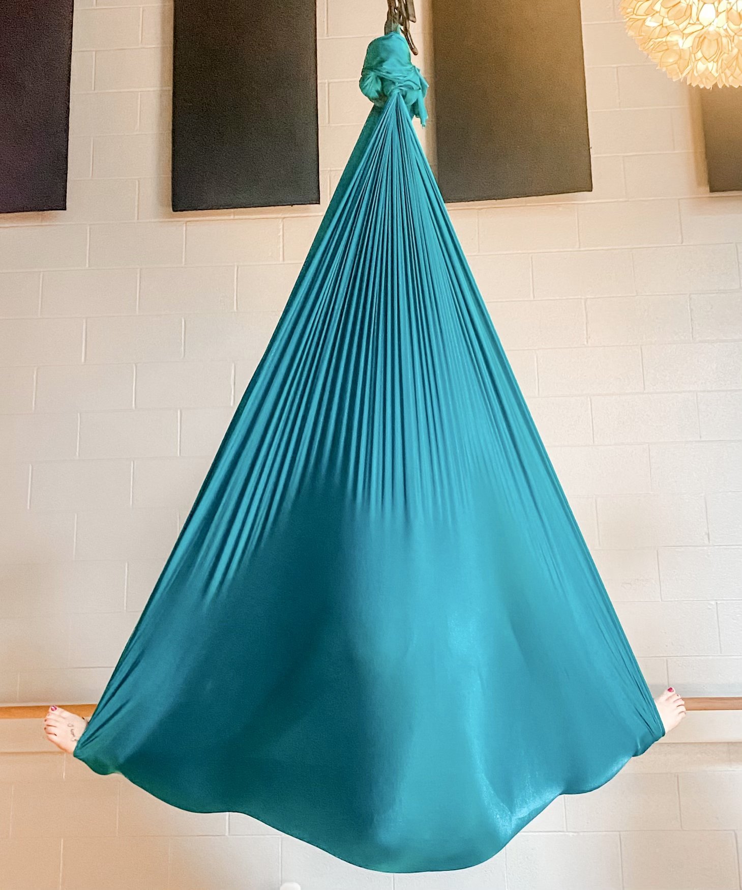 Only three spots left for this Friday's Restorative Yoga in the Aerial Silks! Join Farrah for 90 minutes of self-nourishment. This practice is designed to help guide you into deep states of relaxation and release for both your mind + body. No experie