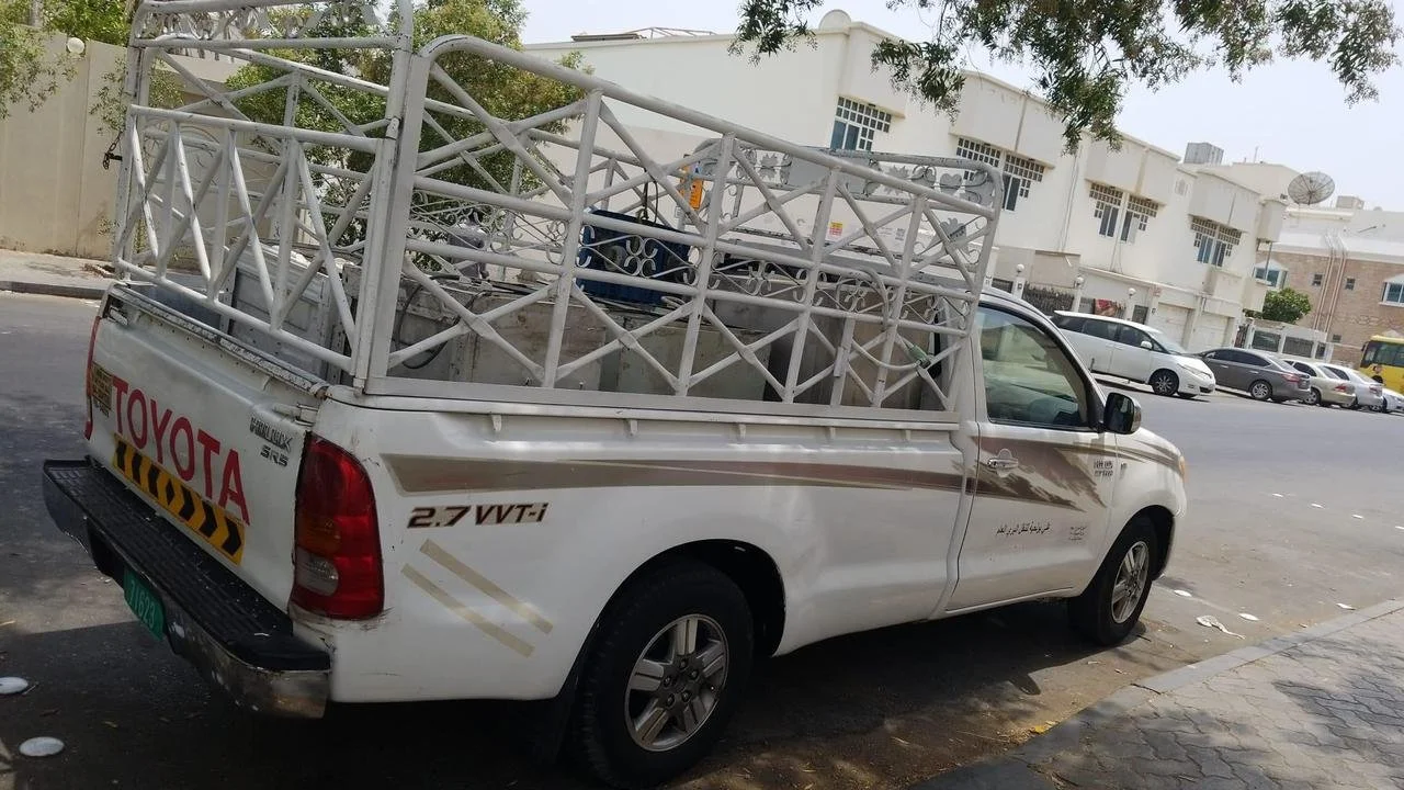 1 ton pickup truck with metal fenced bed for small business delivery and furniture moving in UAE