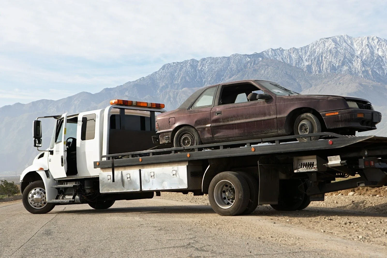 A car is towed in the mountains