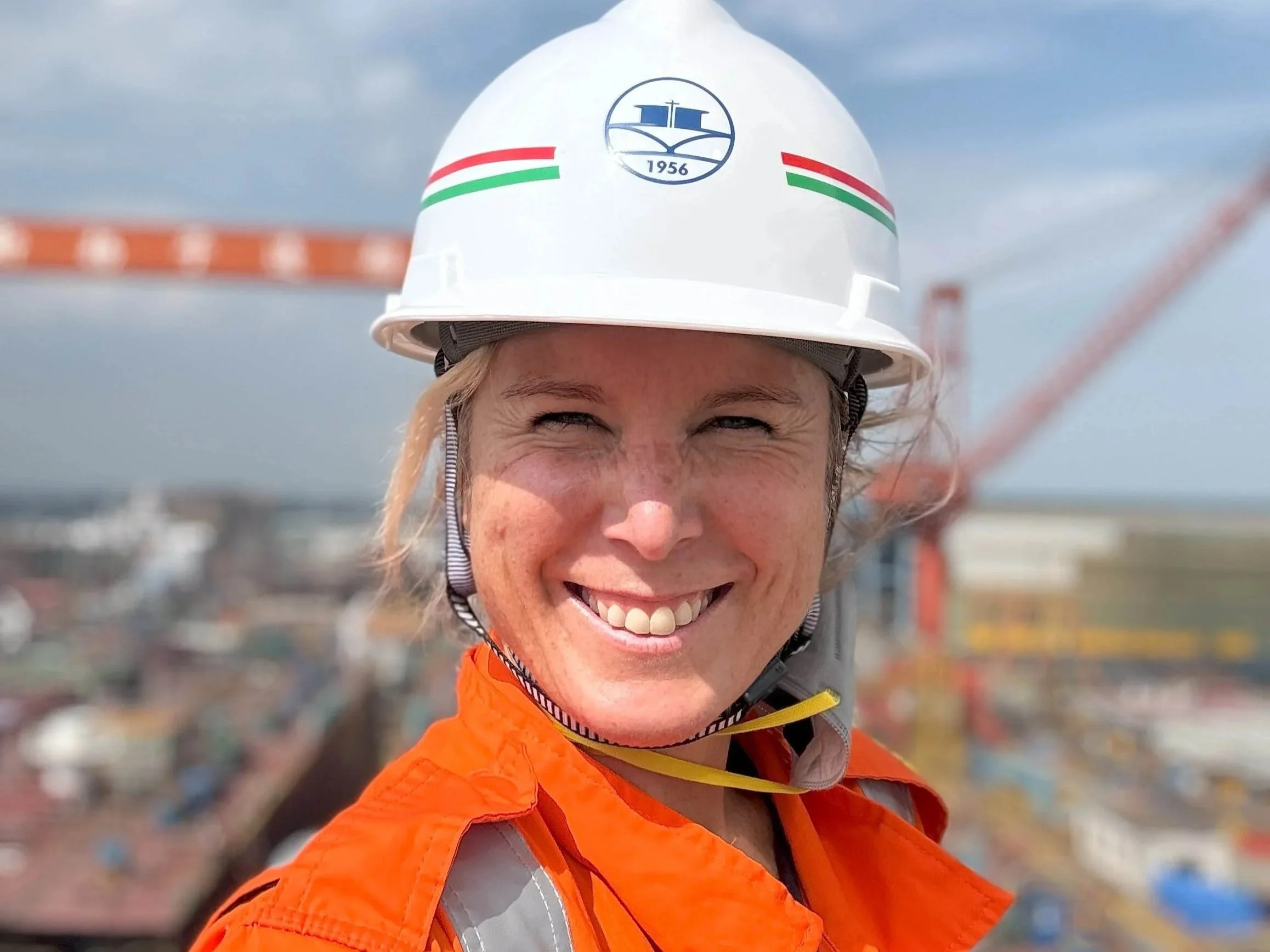 Close up of female seafarer in hardhat