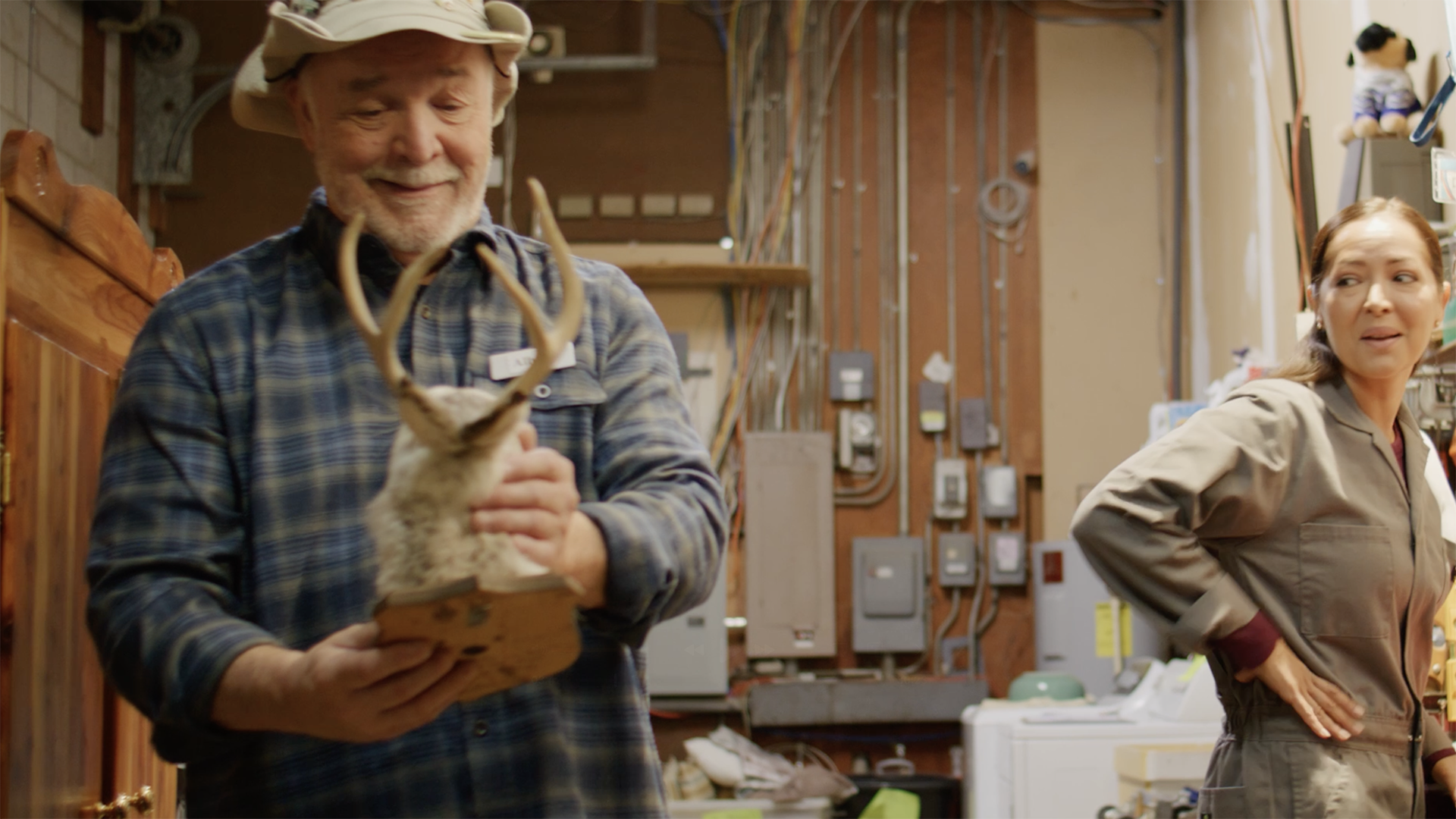 Albert and Ana share a moment in the backroom of the thrift store