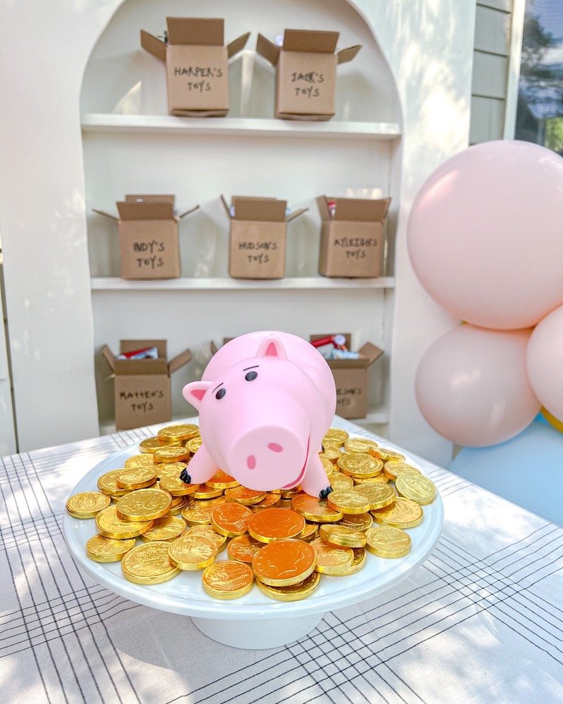 Hamm the Pig from Toy Story on pile of gold chocolate coins