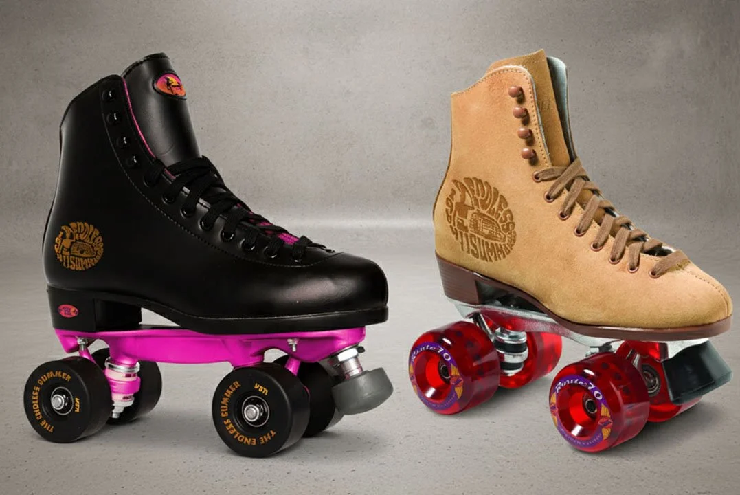 Two pairs of roller skates, one black with pink accents and one tan with beige accents, placed on a plain surface with a neutral background.