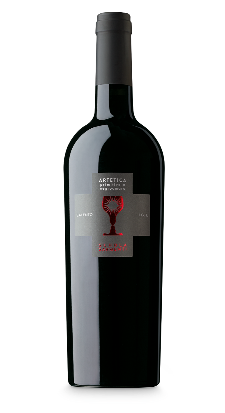 A dark glass wine bottle with a black cap and a label featuring a red and black sunburst design, the words 'ARTETICA' and 'Schola Sarmenti', and the text 'Primitivo e Negroamaro,' 'Salento,' and 'I.G.T.'