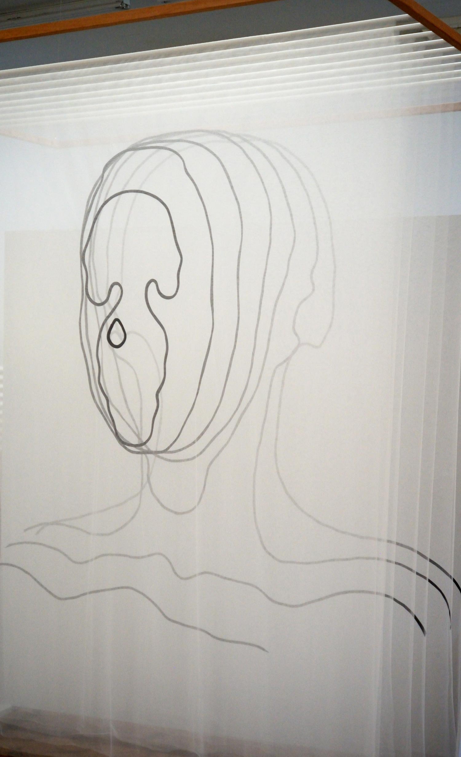 Facial Topography, 2019, nylon tulle, bias tape, machine and hand stitching, wood and metal, textile (right) by Jaya Griscom