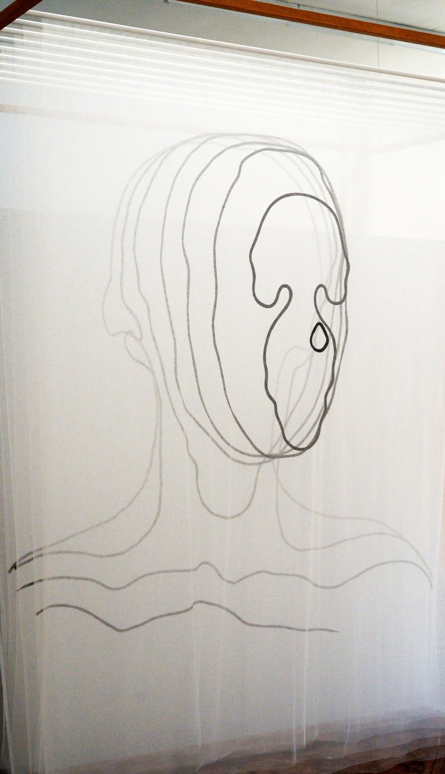 Facial Topography, 2019, nylon tulle, bias tape, machine and hand stitching, wood and metal, textile (left) by Jaya Griscom