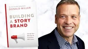 donald miller smiles next to his book building a storybrand