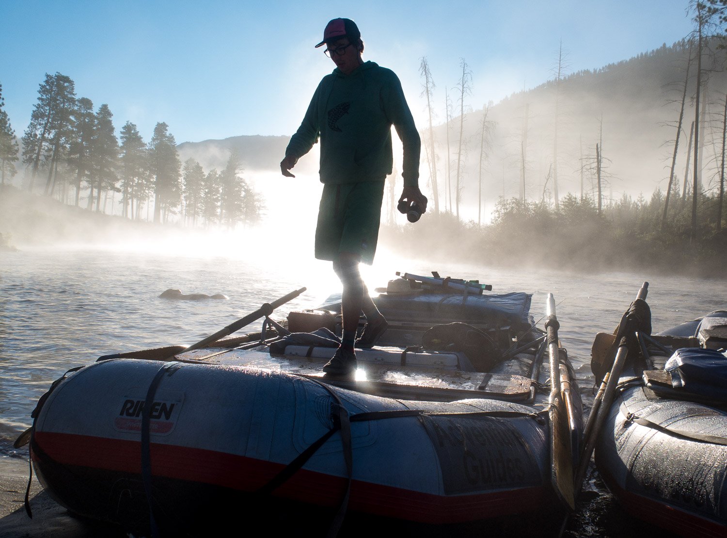parker thornton steps off a boat in the early morning light.jpg