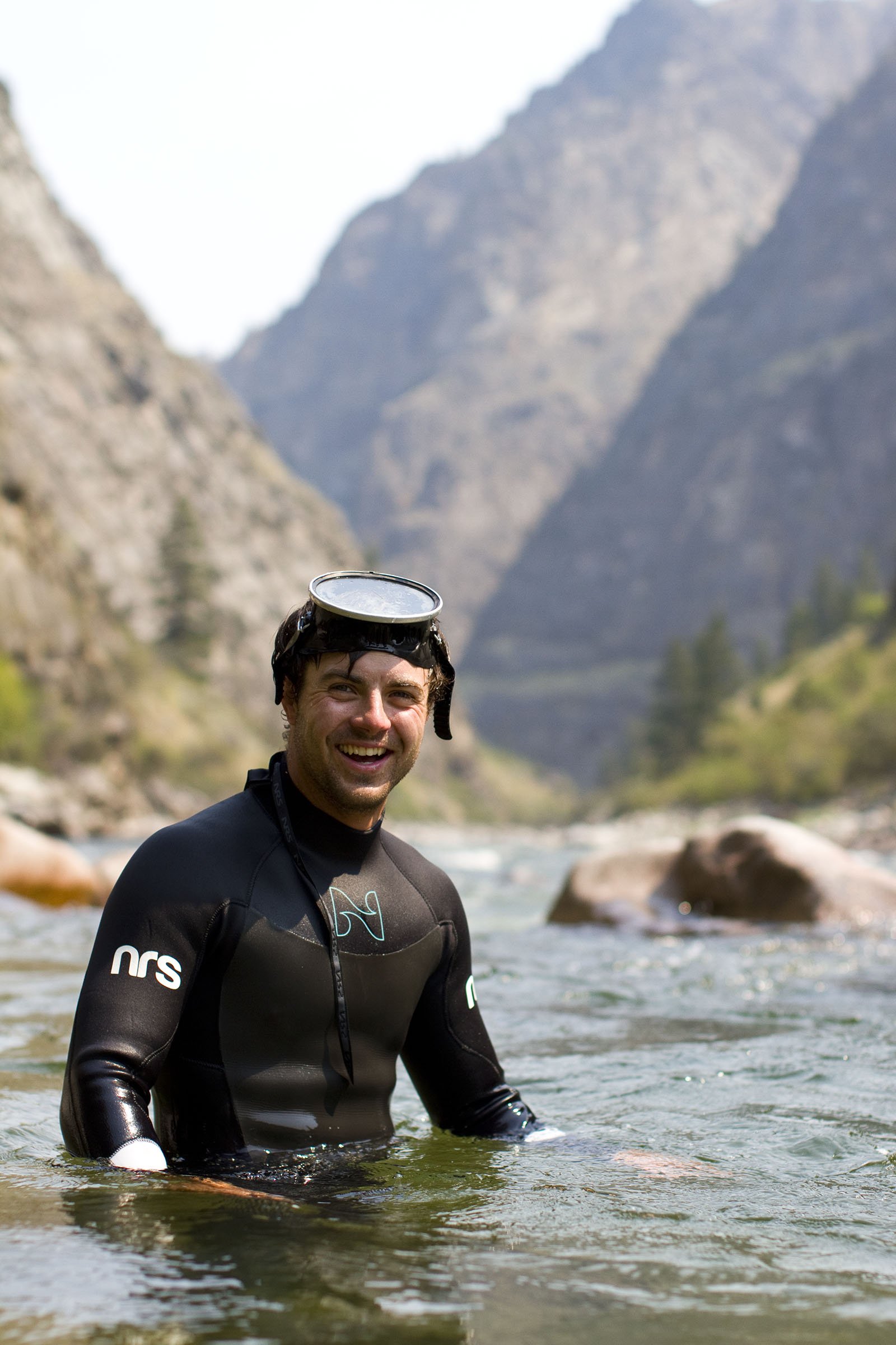 guide kyle smith snorkels the river looking to salvage lost gear.jpg