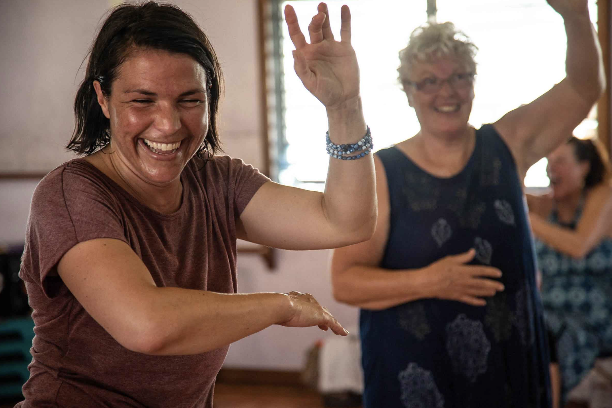two women dancing in a class