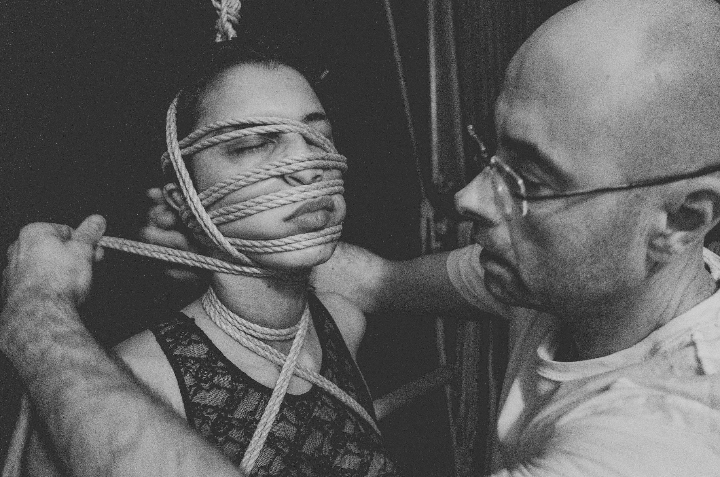 Two people practicing rope bondage showing how folks in the kink, bdsm, and non-monogamous, poly, enm communities can sometimes recreate high-control environments if not communicating or allowing for collaboration, dissent, or autonomy.