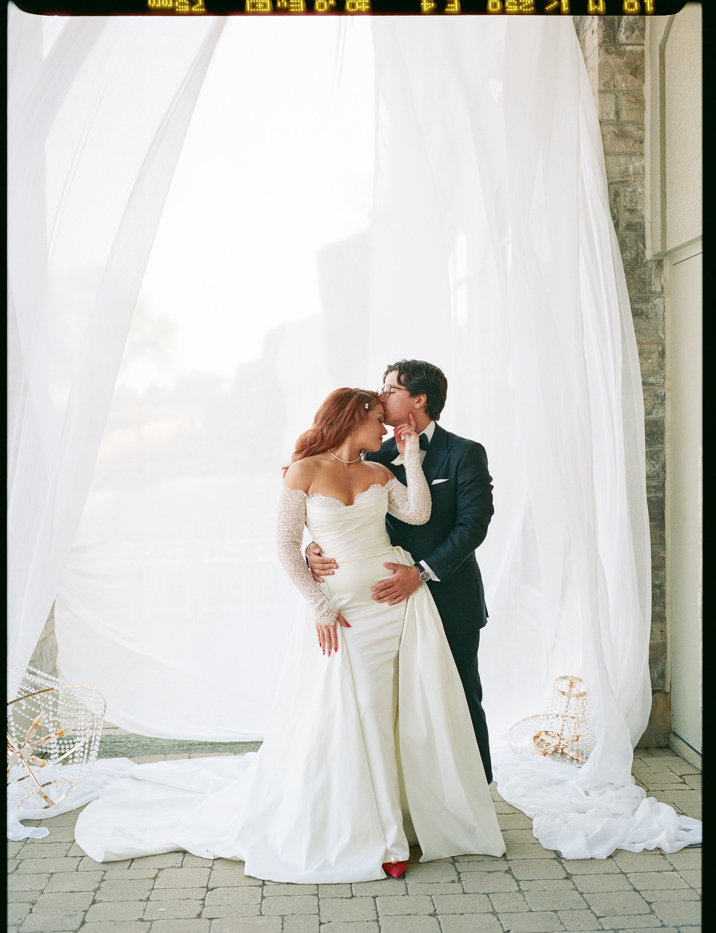 Bride and Groom in front of Decor