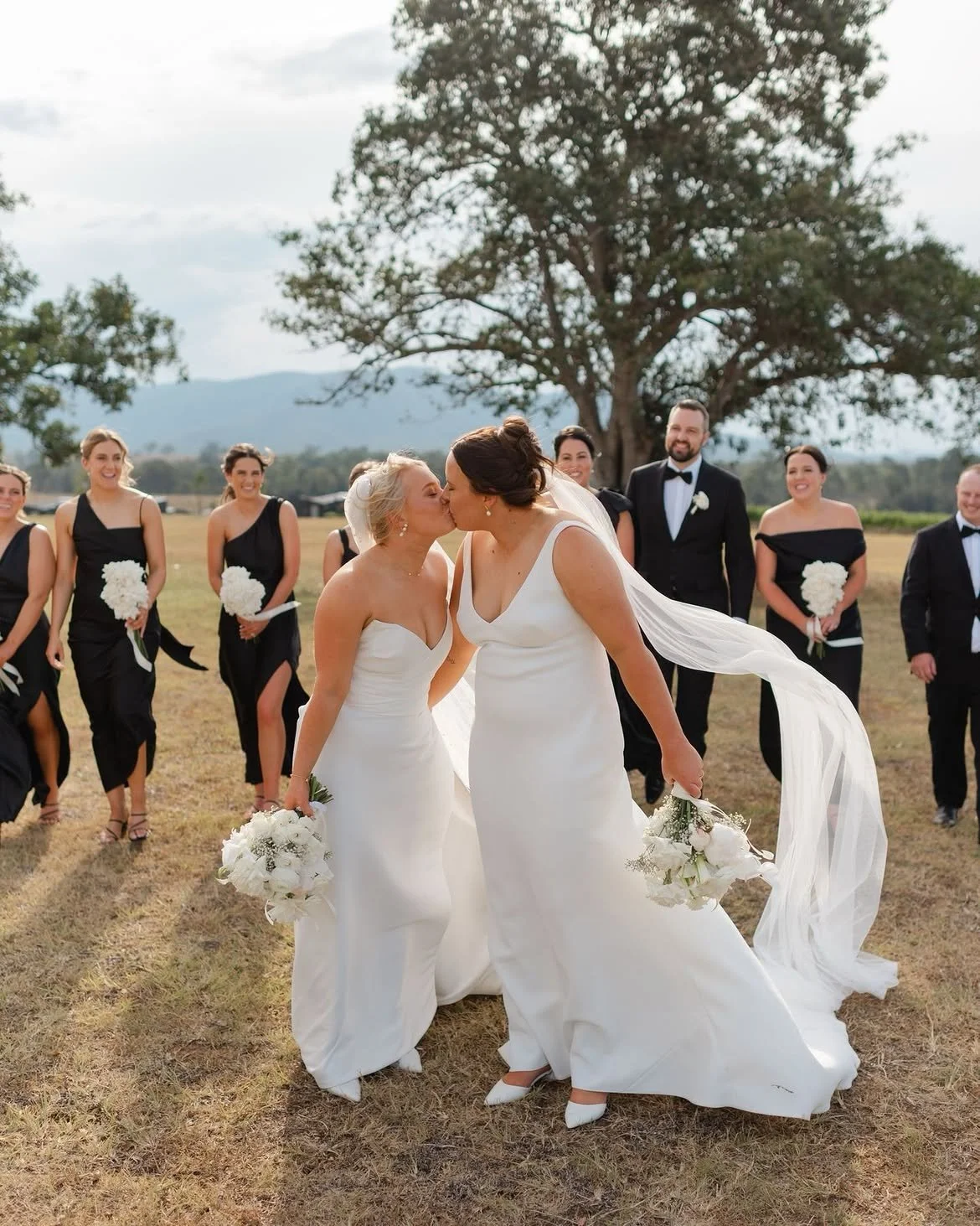 The kind of love that doesn’t need words.  Beth & Holly, wrapped in vineyard light and that look.jpg