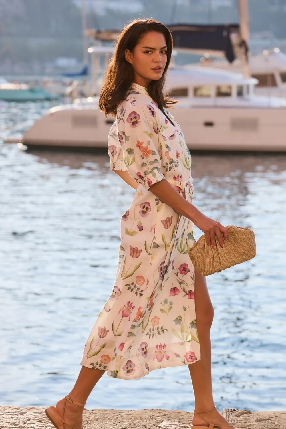 Sportscraft campaign: floral midi dress on a harbour wall with yachts behind