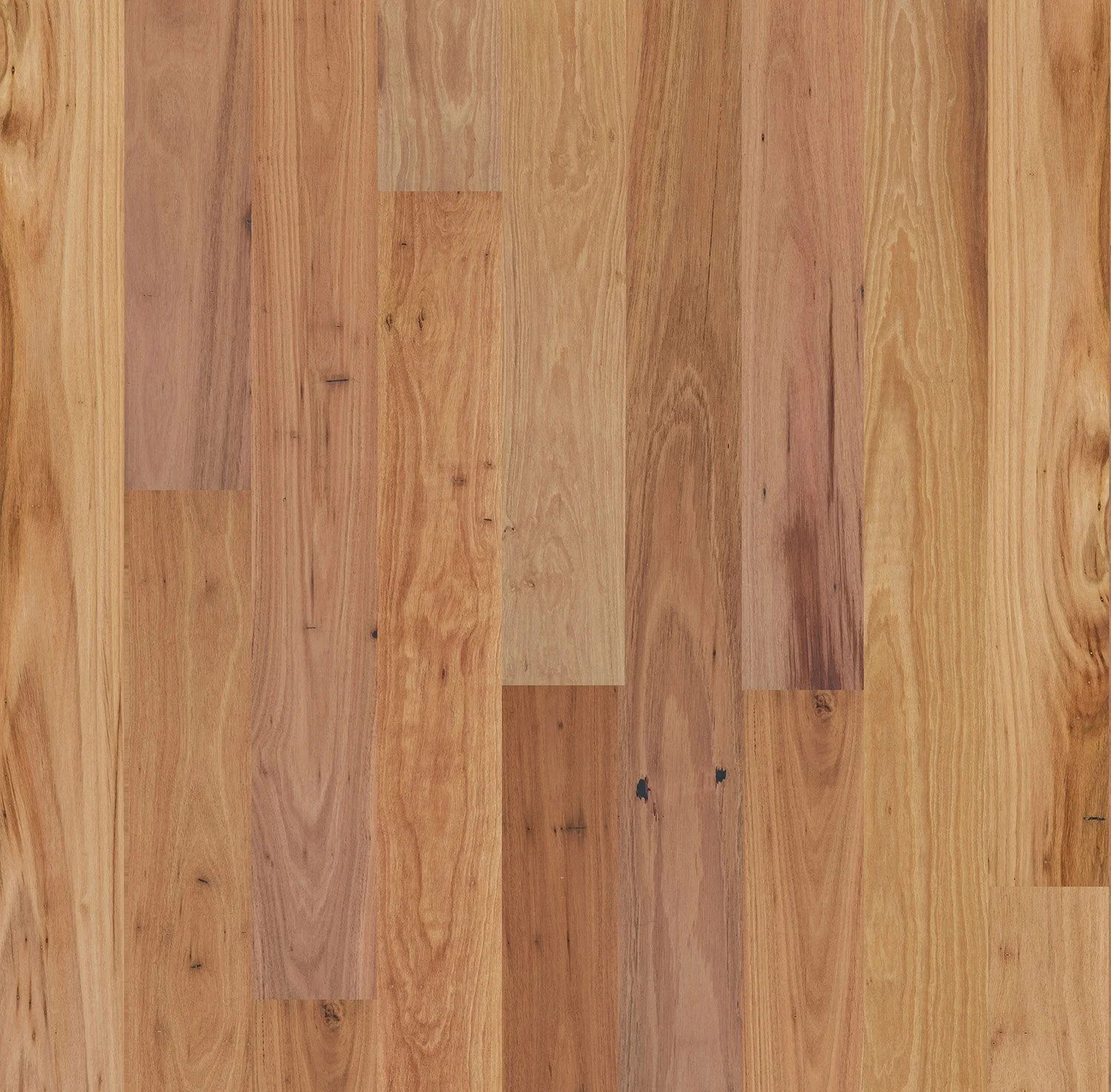 Close-up of a wooden floor with a natural finish, showing wood grain patterns and a variety of light to medium brown tones.