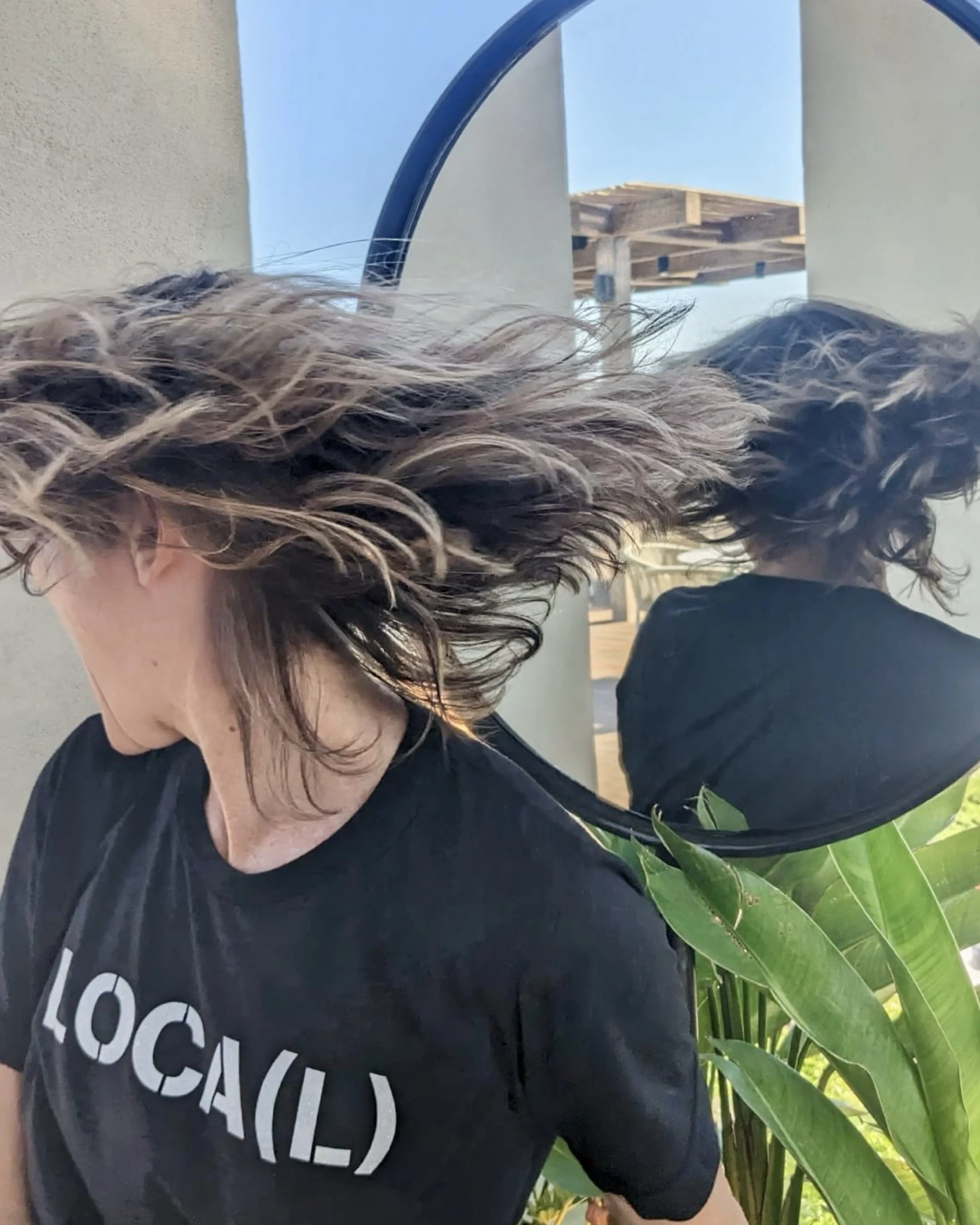 artist wears t-shirt with stencil