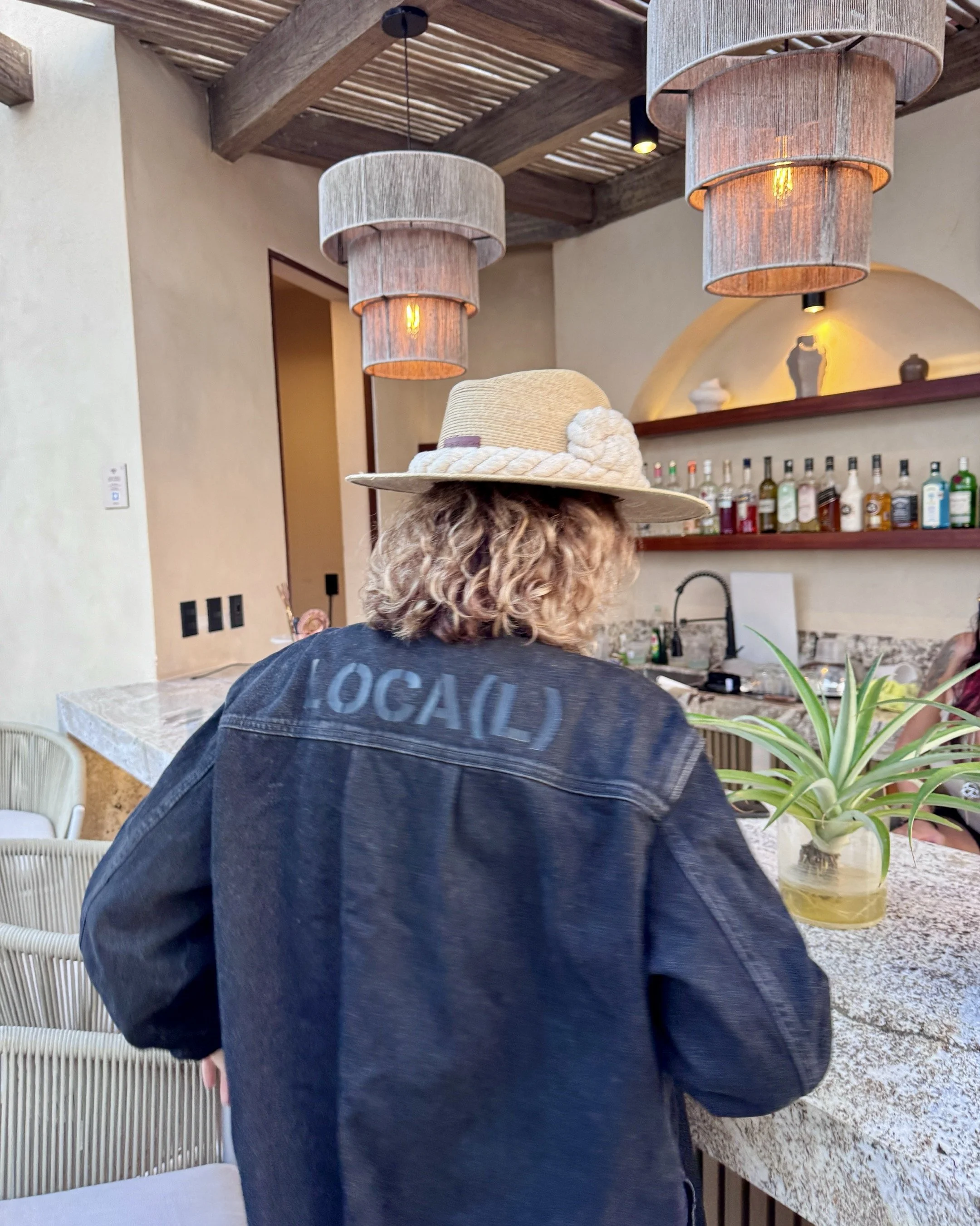 artist wears jacket with stencil