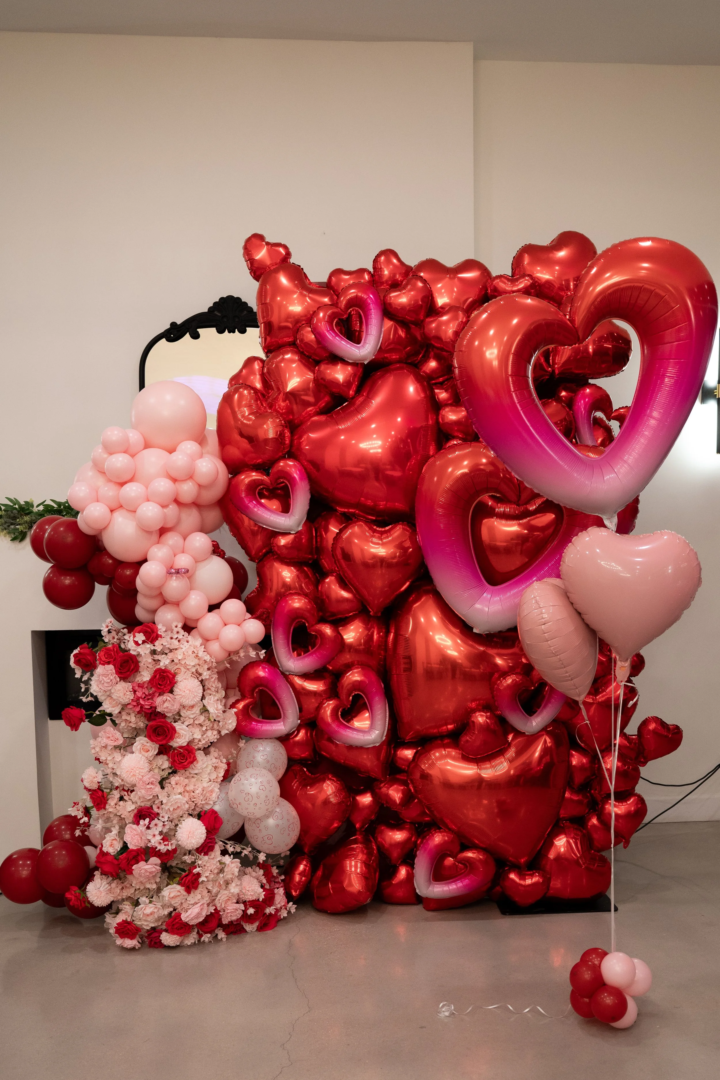 True 8x4 Heart wall with floral arch and balloons. 