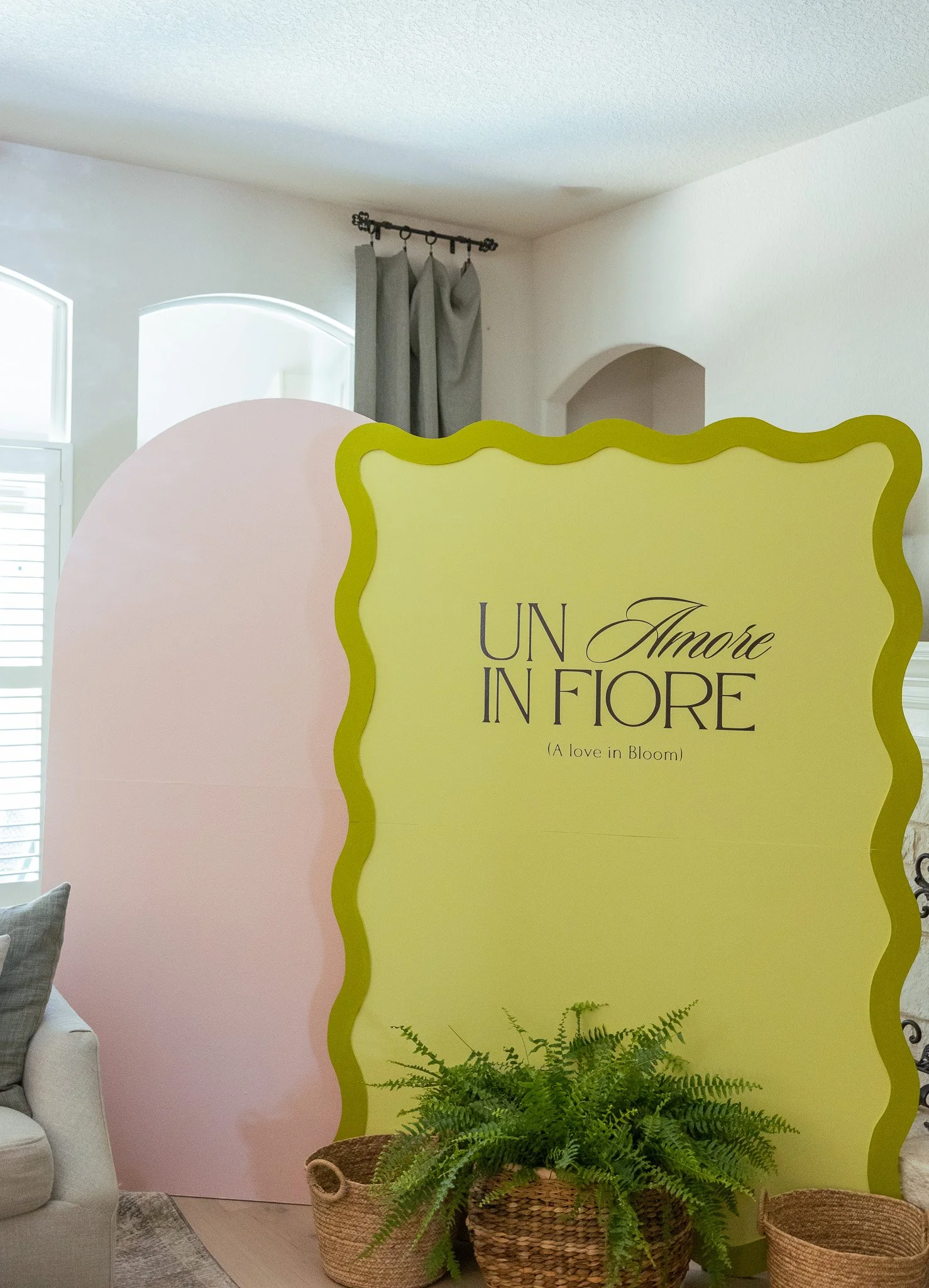 Wavy backdrop with custom vinyl and arch backdrop rental.
