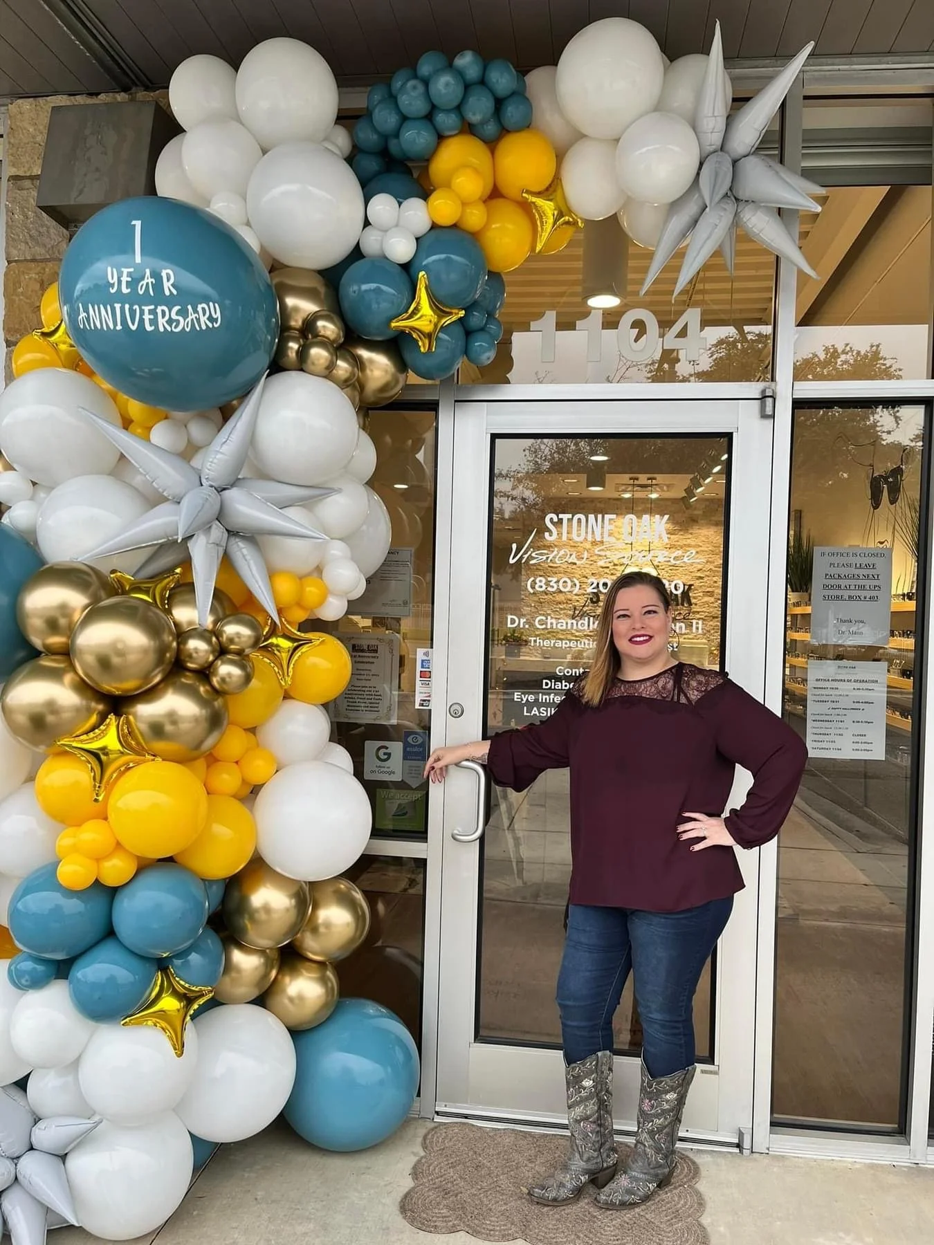 A custom corporate balloon display created for Vision Source Stone Oak’s one year anniversary. This welcoming entrance featured branded balloons, organic balloon décor, and elegant details to celebrate a successful year in business.