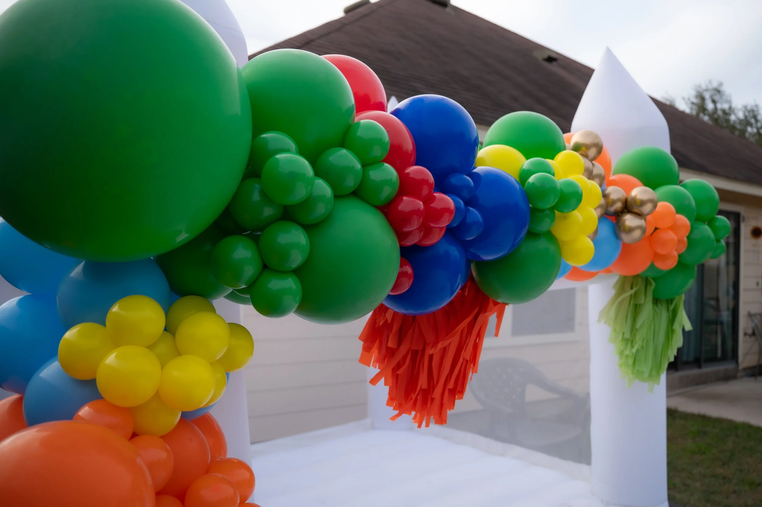 Organic balloon installation on Bounce House in Fox Grove neighborhood. 