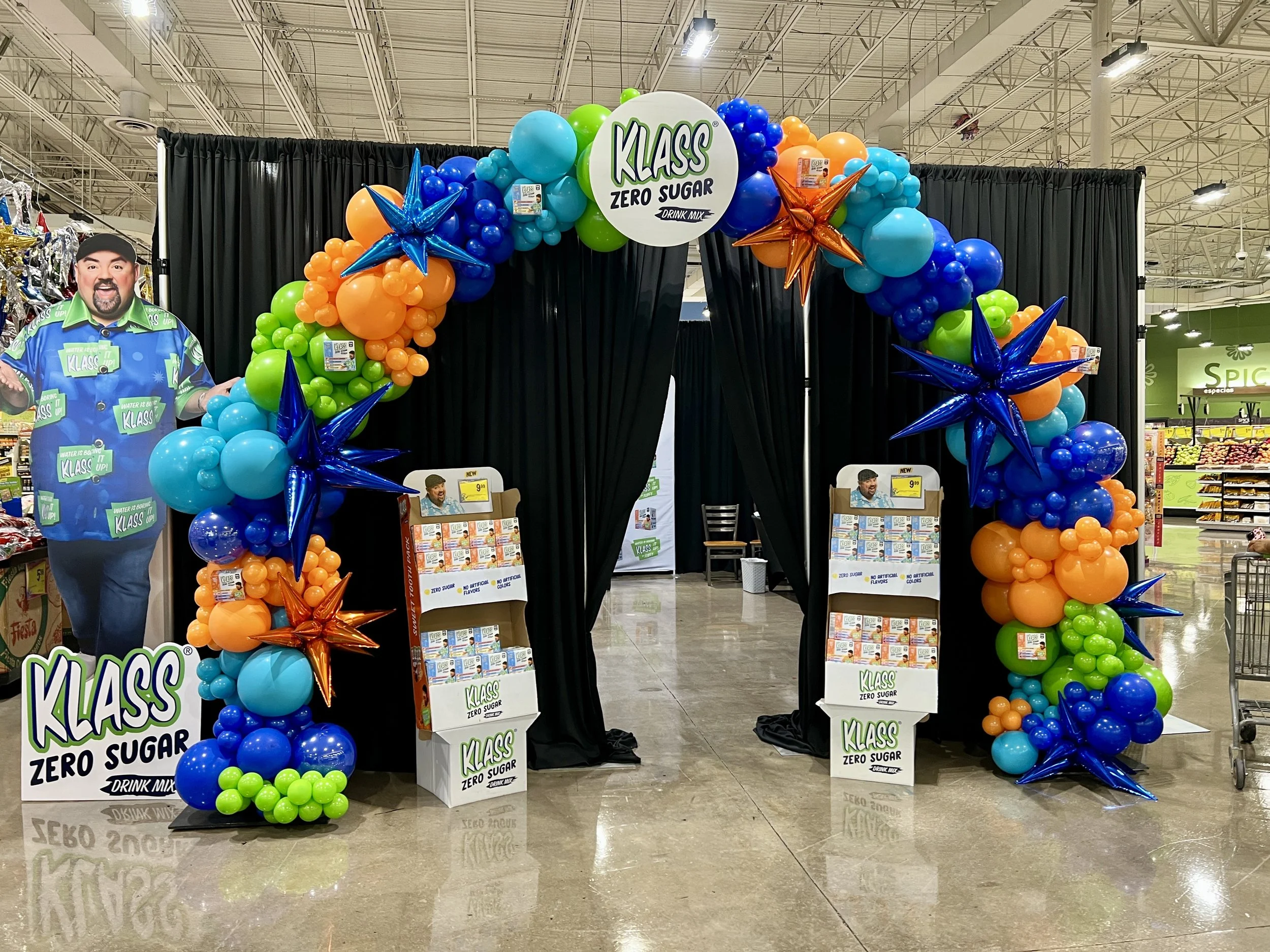 Colorful Balloon arch for Klass Fluffy Meet and Greet at Fiesta Mart in Austin, Texas by True Celebrations. 
