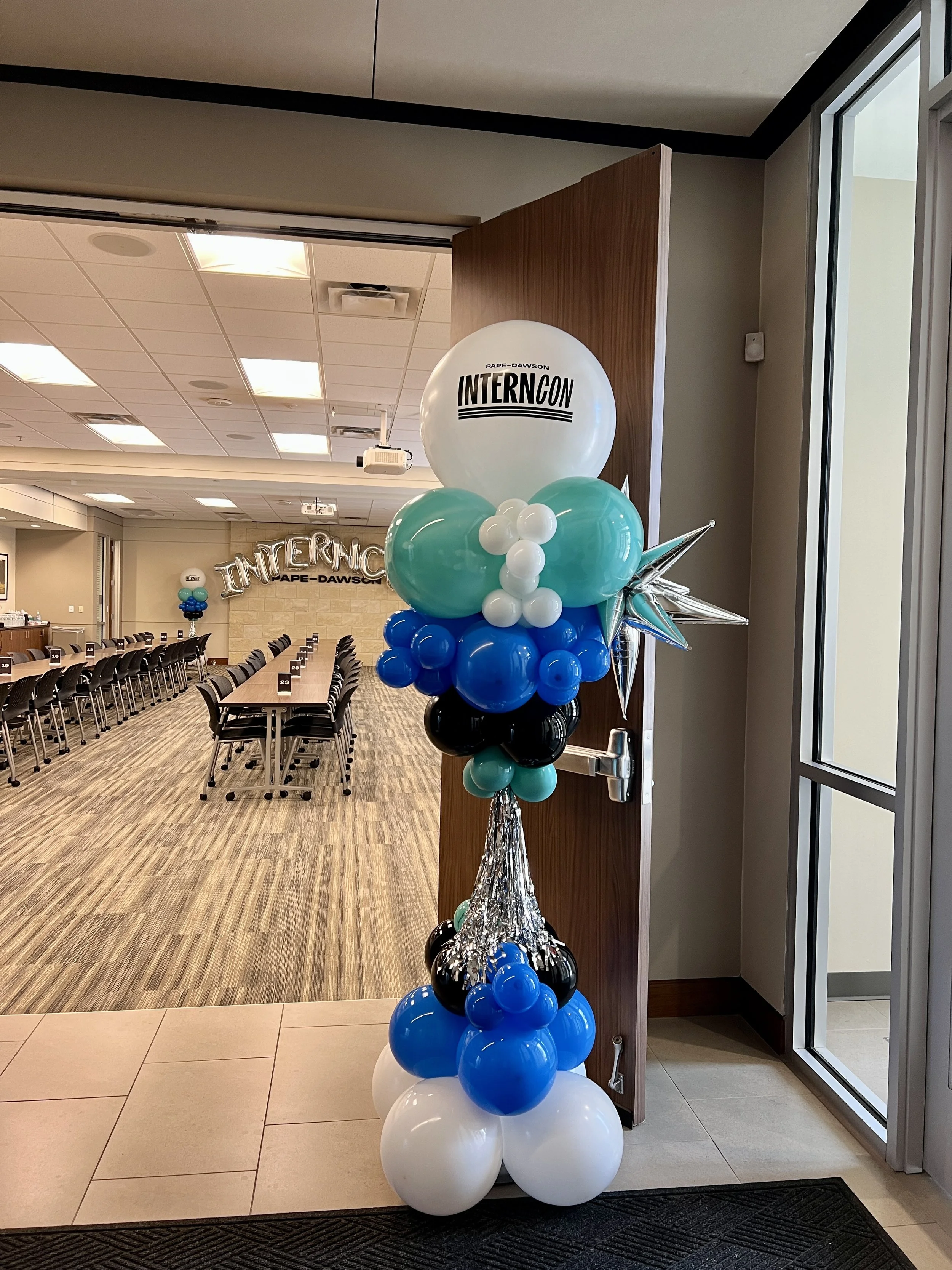 True Celebrations designed custom corporate balloon décor for Pape-Dawson’s InternCON event in San Antonio. Featuring branded balloon displays in the company’s signature colors, this installation created a welcoming and professional atmosphere for in