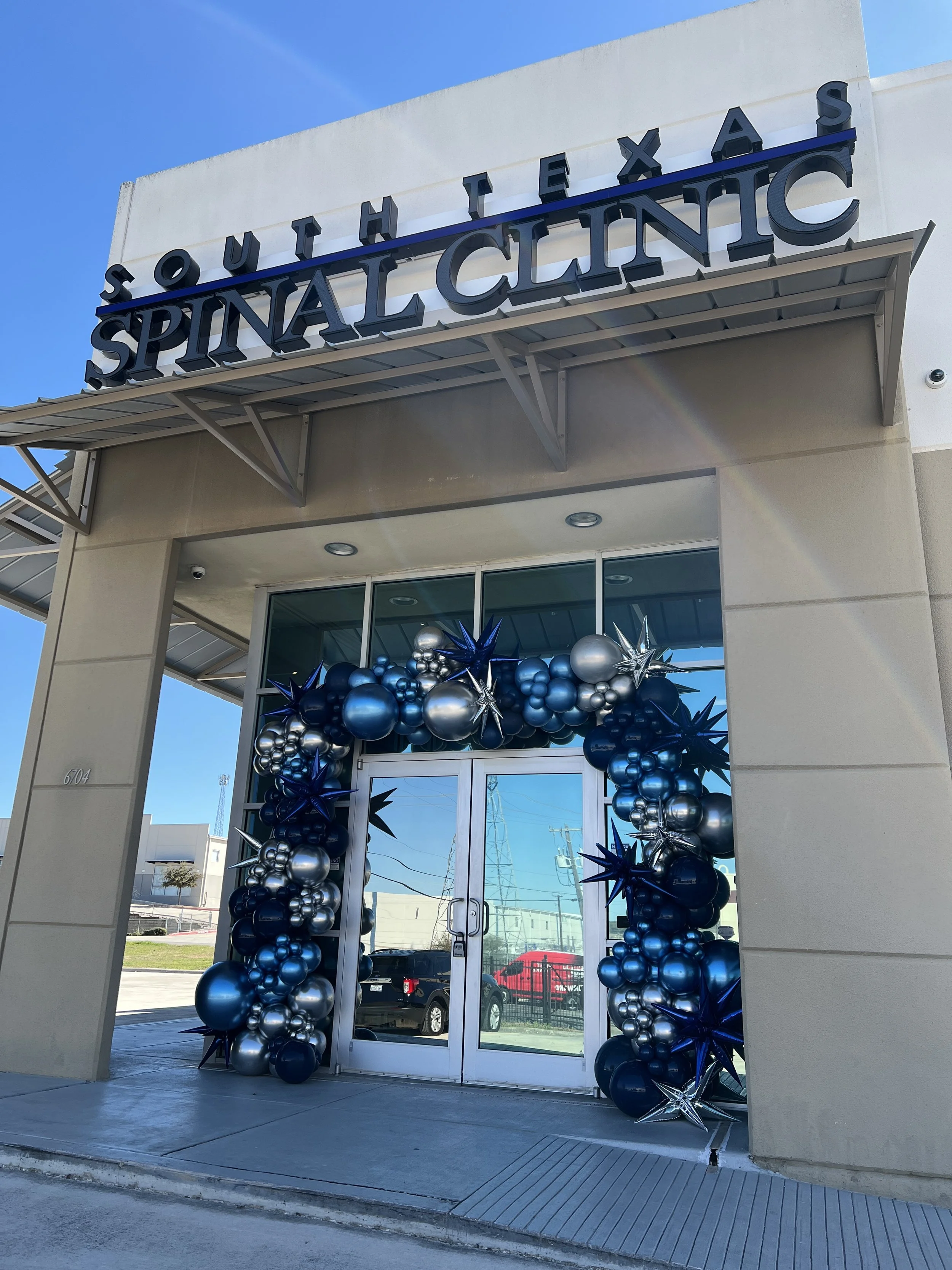 Medical Clinic Grand Opening Balloon Setup. Organic balloon entry way garland.  