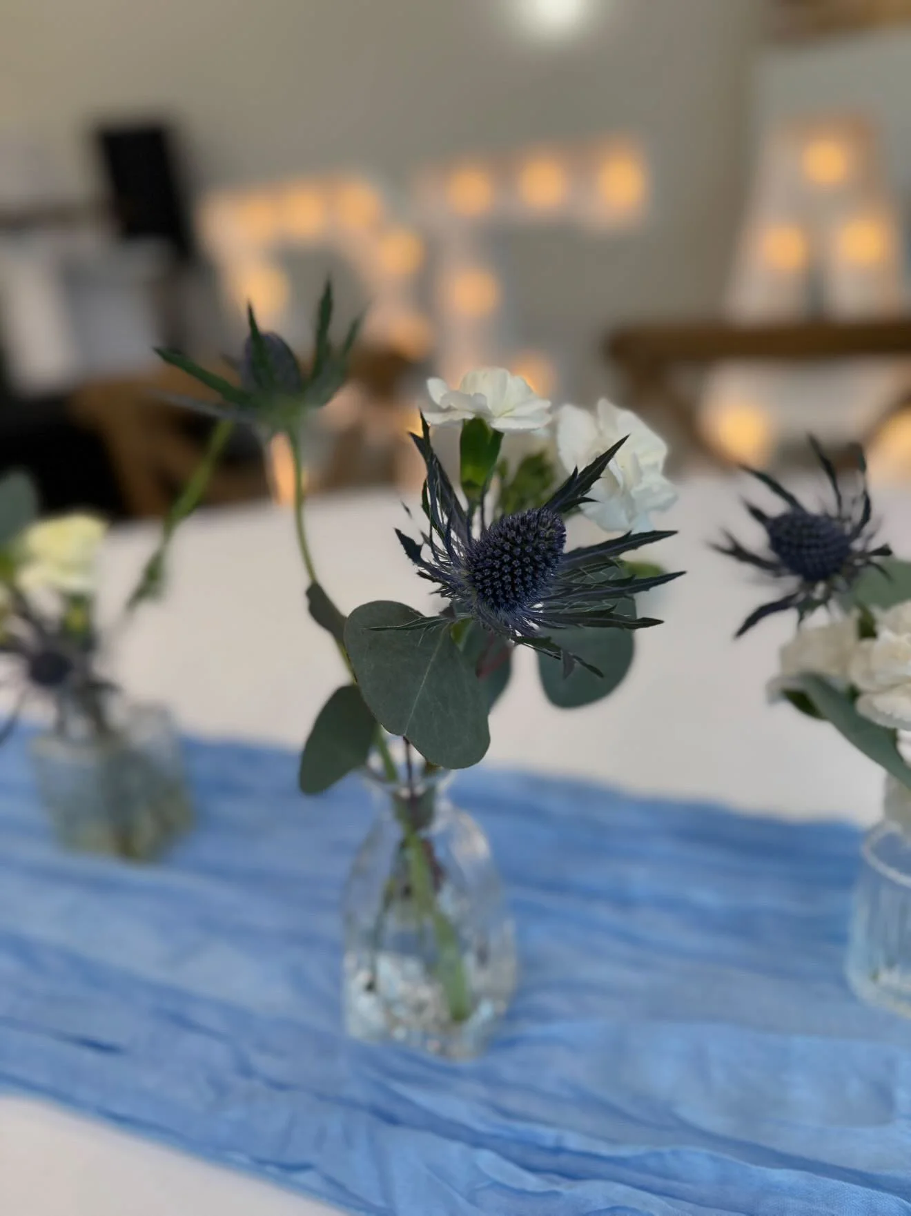 Bud vases with flower arrangements.