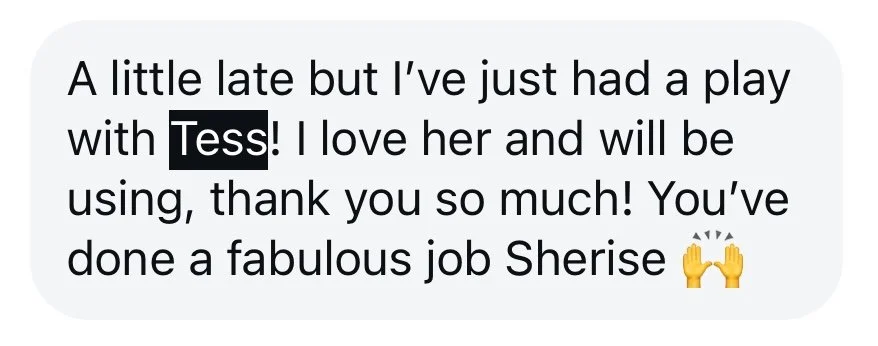 Text message reading 'A little late but I've just had a play with Tess! I love her and will be using, thank you so much! You've done a fabulous job Sherise 🙌'