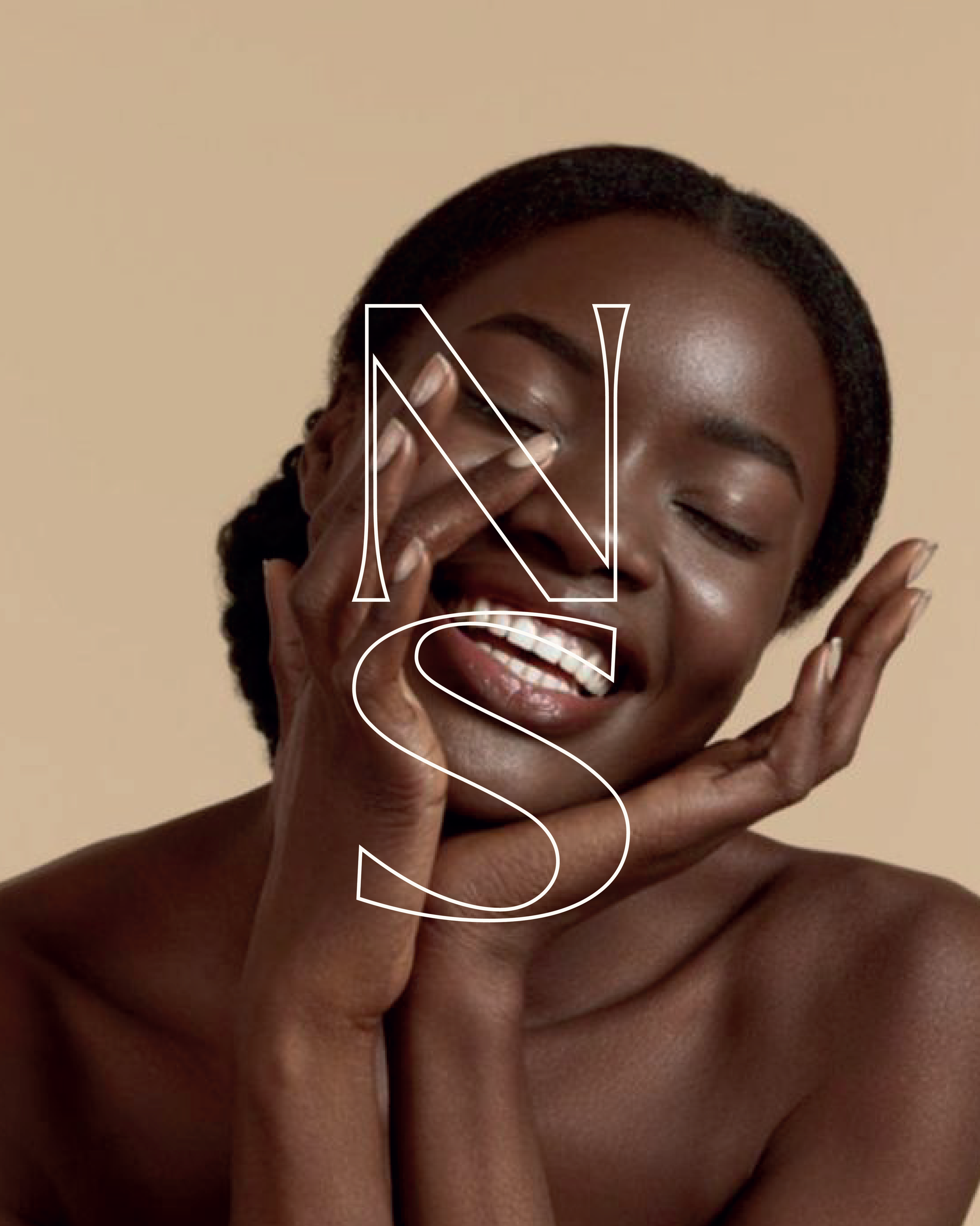 Close-up of a smiling woman with natural hair, touching her face, with the letters N and S superimposed on the image.