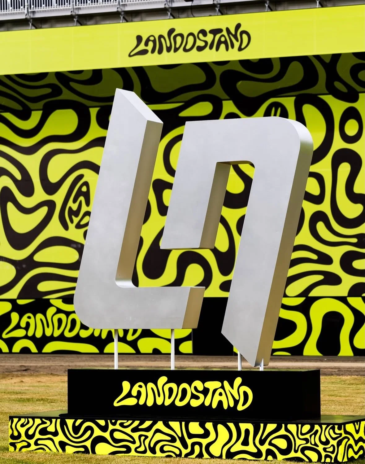 One of the standout sights from the 2026 British Grand Prix was the Landostand, where thousands of Lando Norris fans turned the grandstand into a sea of fluorescent yellow, creating one of the most visually striking and energetic spectacles in Formul