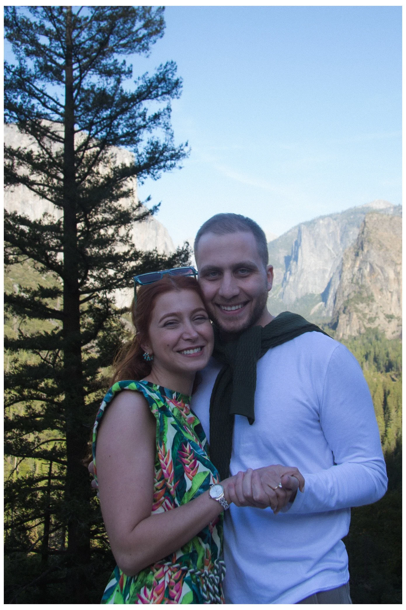 engagement / couple - happy newly engaged couple with mountains as their backdrop